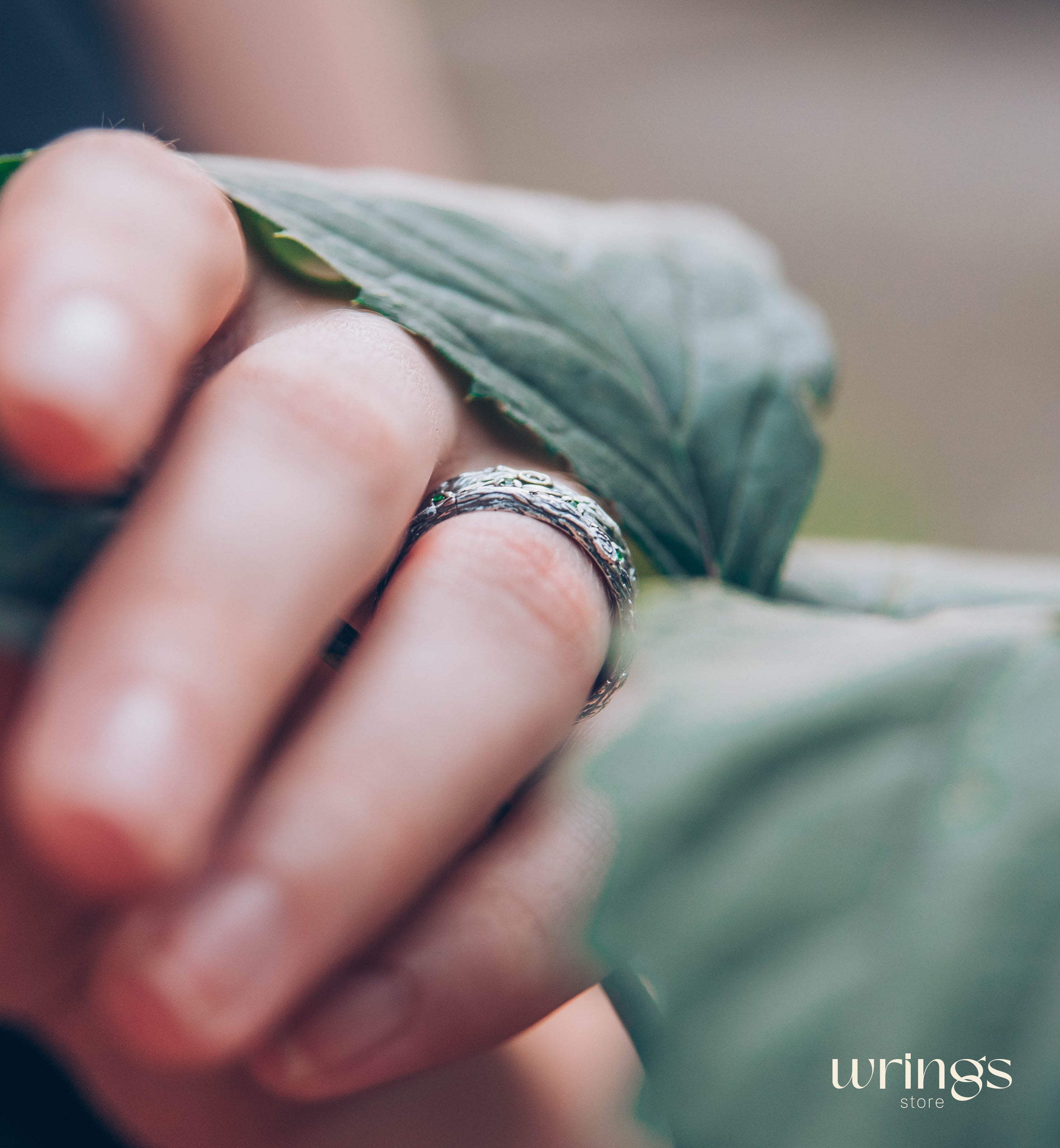 Silver Leaves and Branch Statement Wedding Band with Emeralds