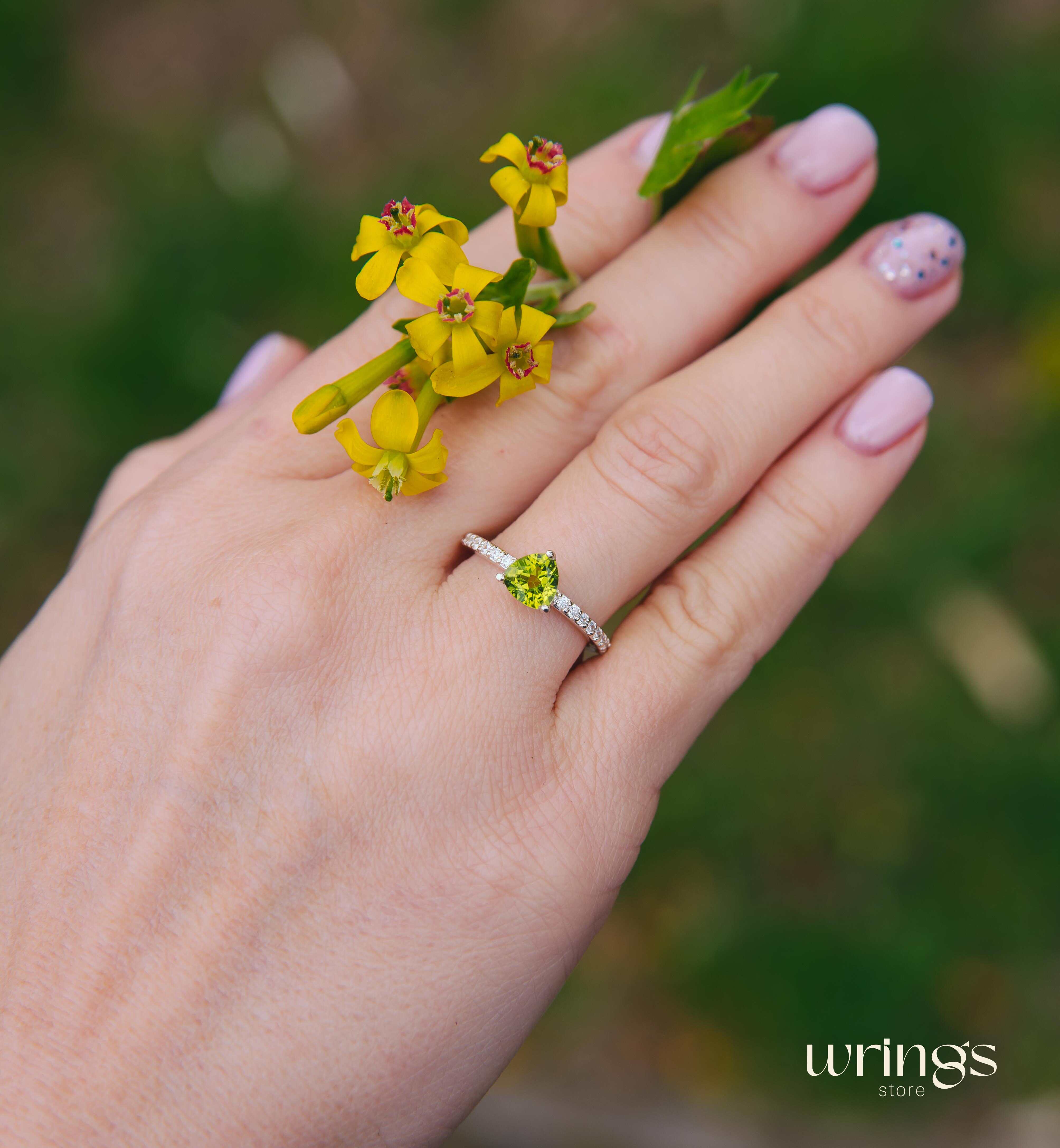 Trilliant Peridot Engagement Ring & CZ Side Stones