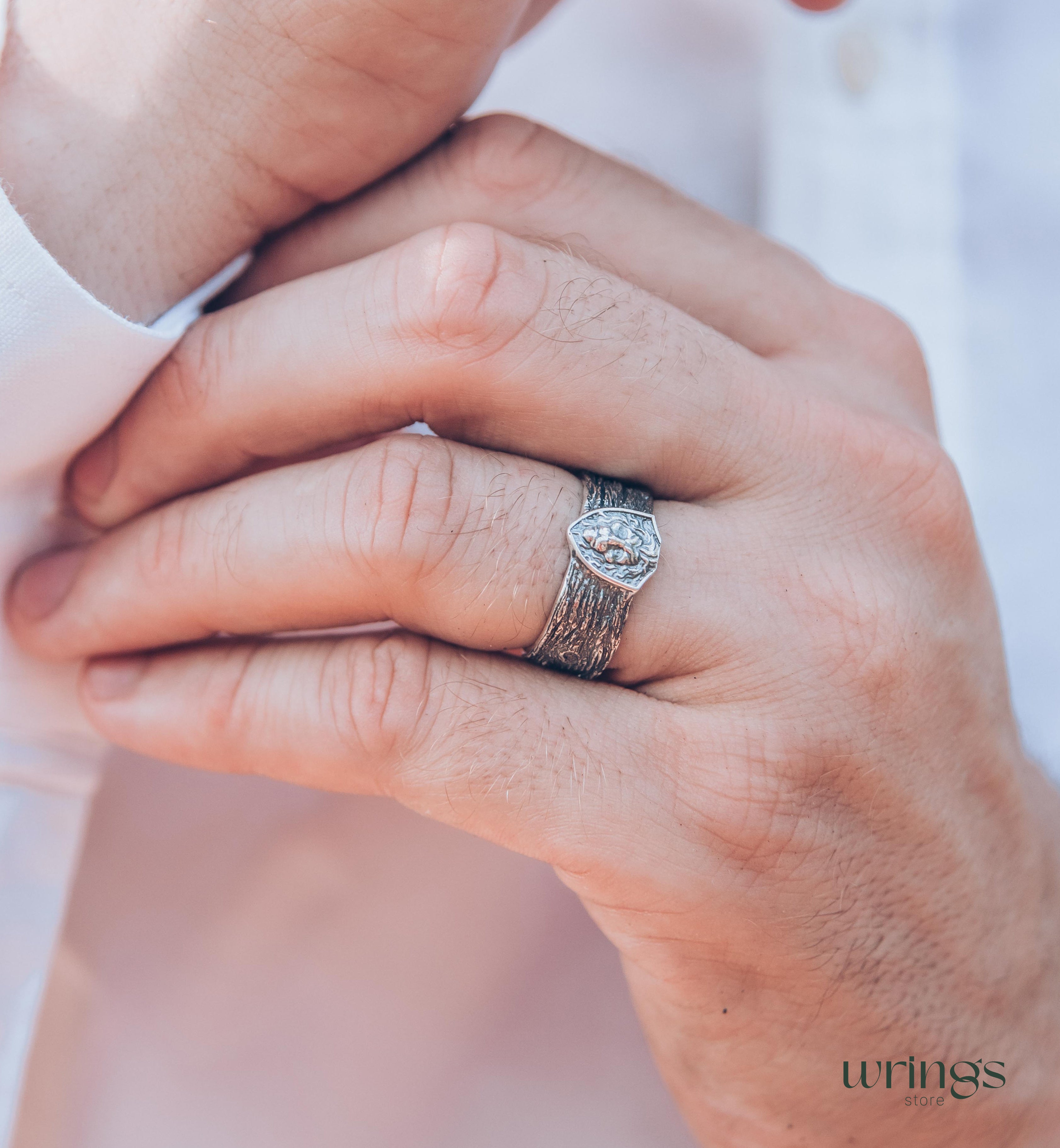 Unique Solid Silver Lion head Ring for Men placed in a Shield