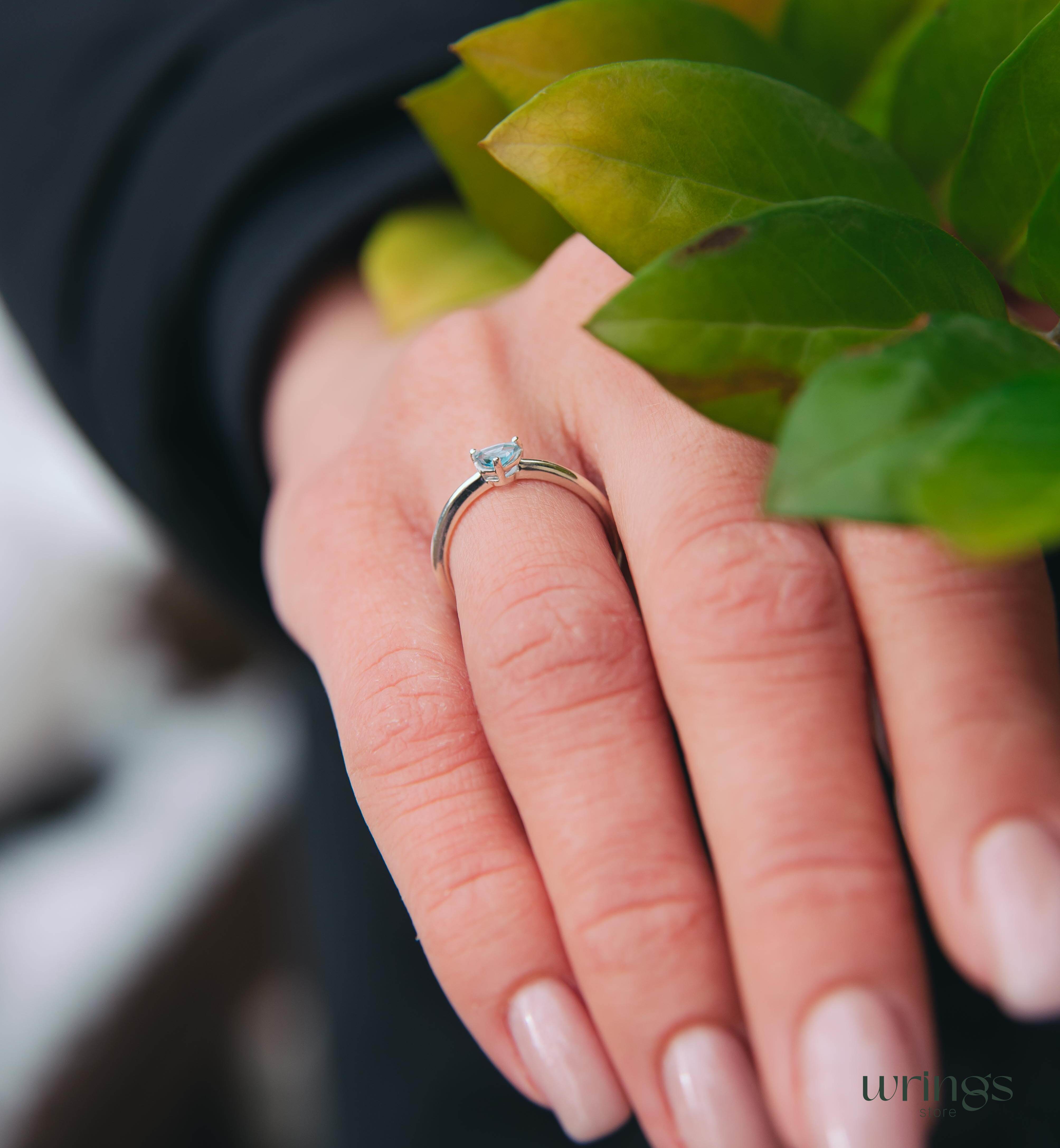 Blue Swiss Topaz Trillion Solitaire Ring in Silver