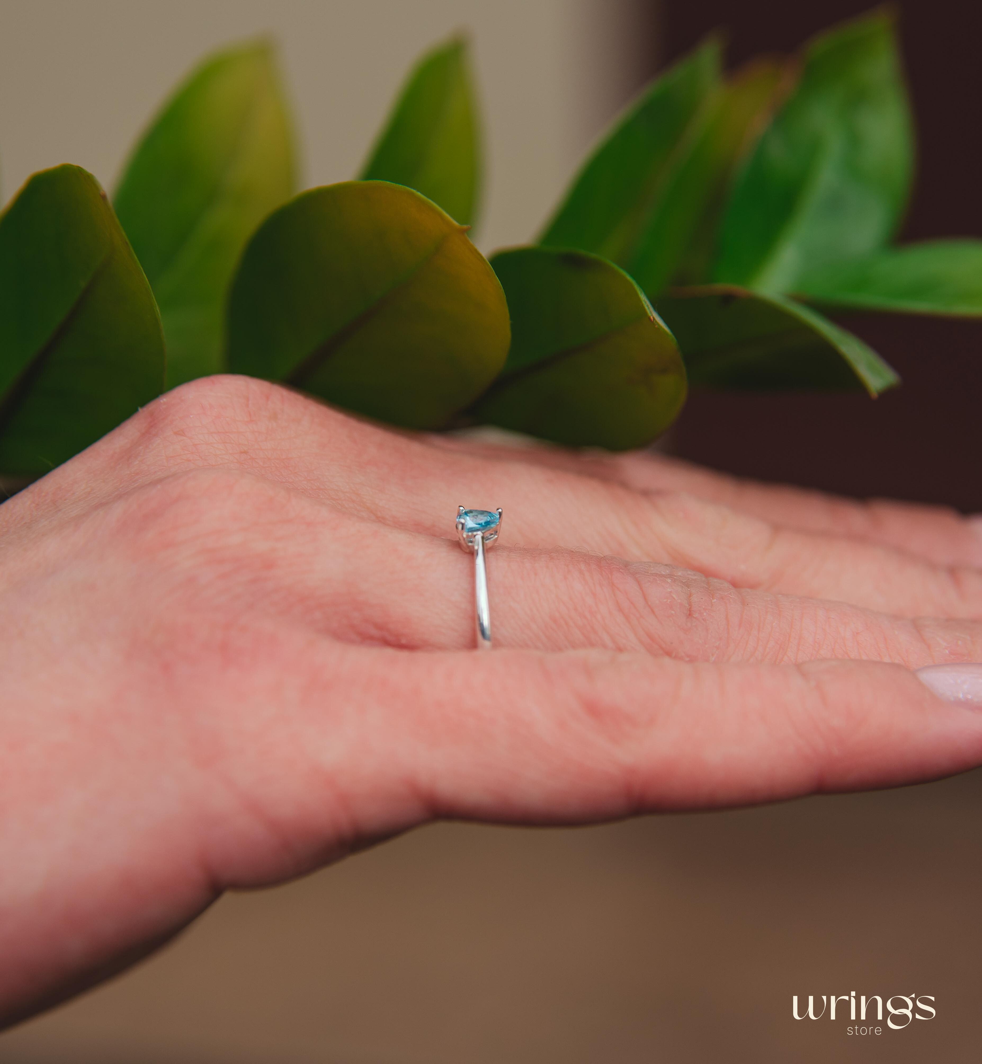 Blue Swiss Topaz Trillion Solitaire Ring in Silver