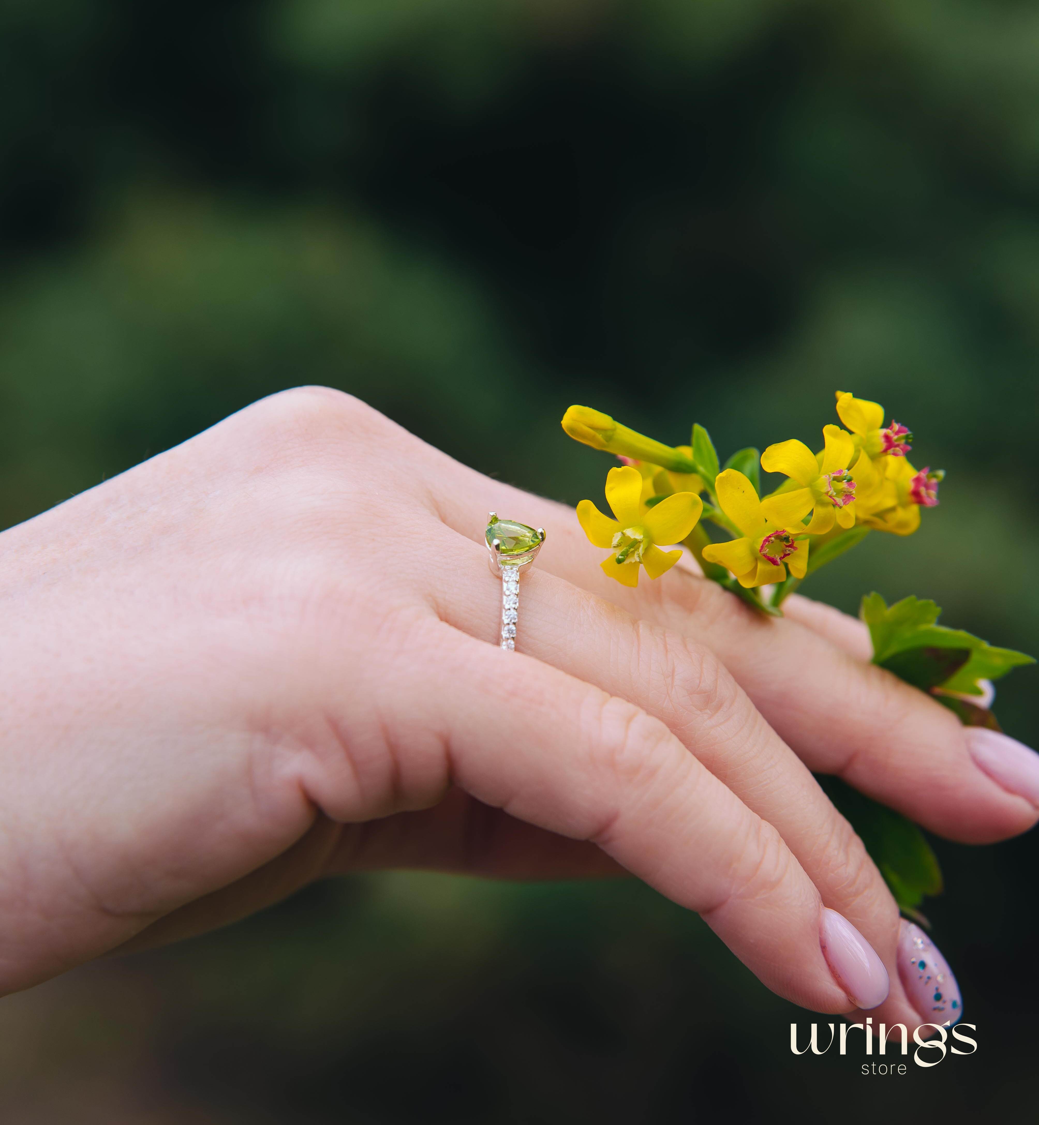 Trilliant Peridot Engagement Ring & CZ Side Stones
