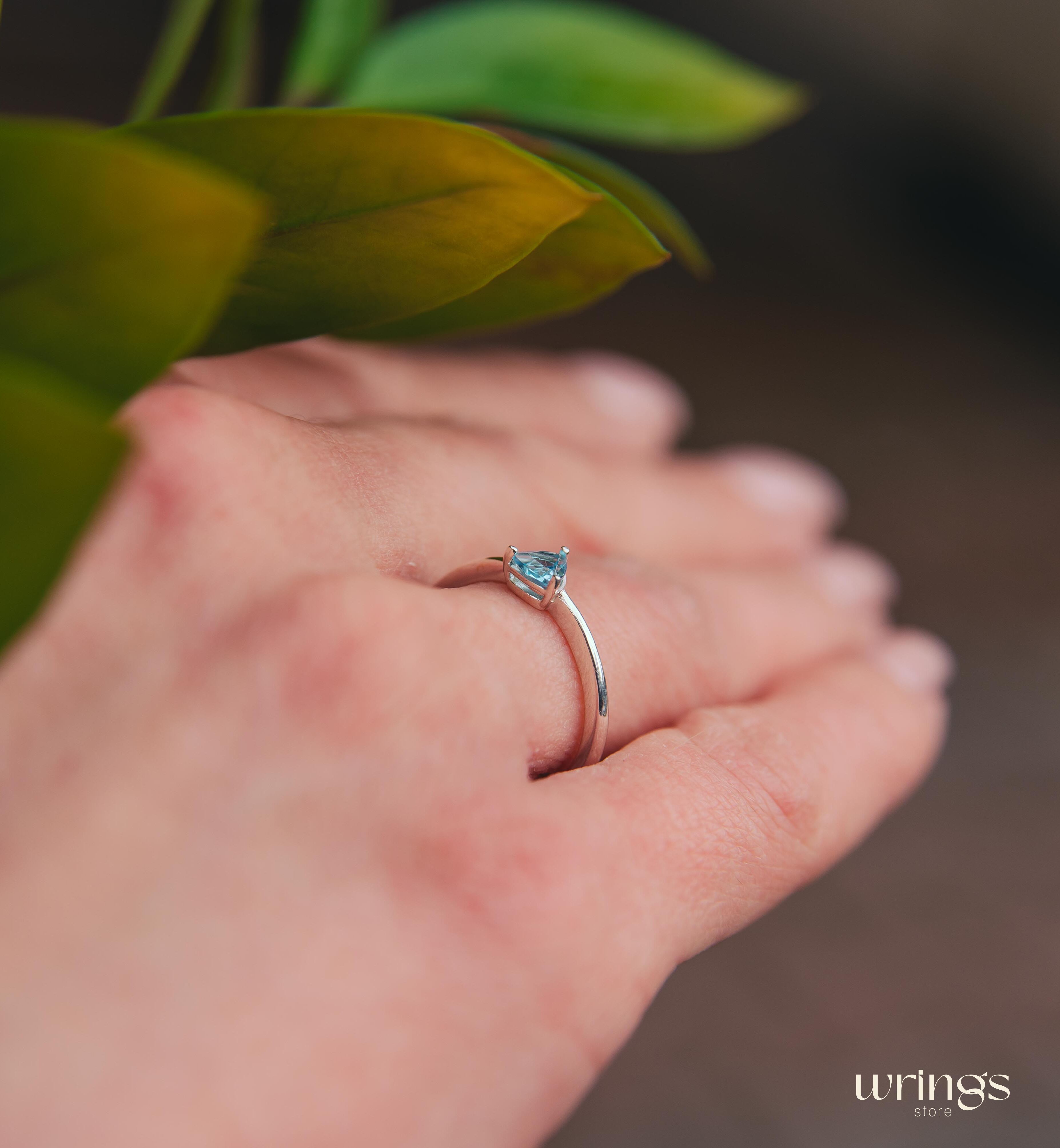 Blue Swiss Topaz Trillion Solitaire Ring in Silver