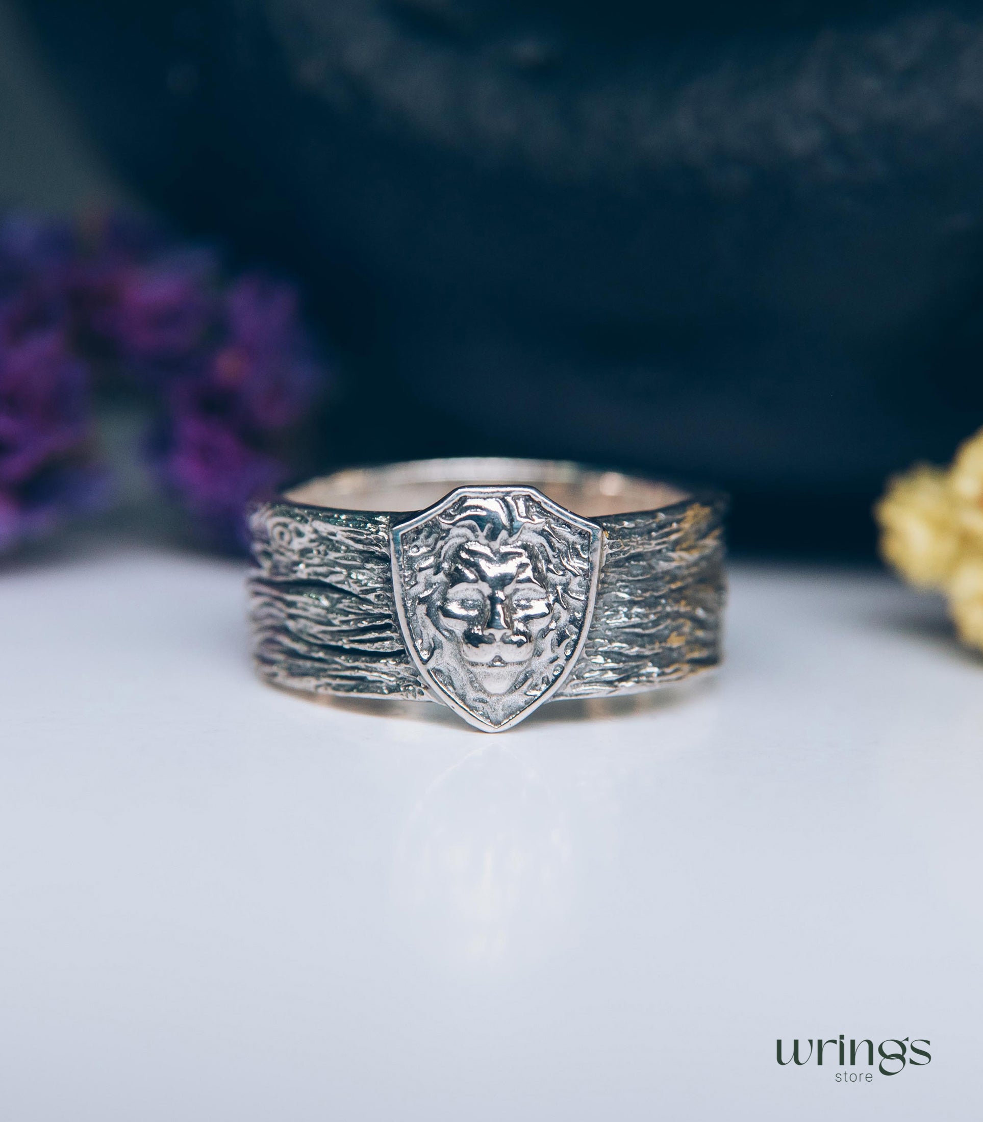 Unique Solid Silver Lion head Ring for Men placed in a Shield