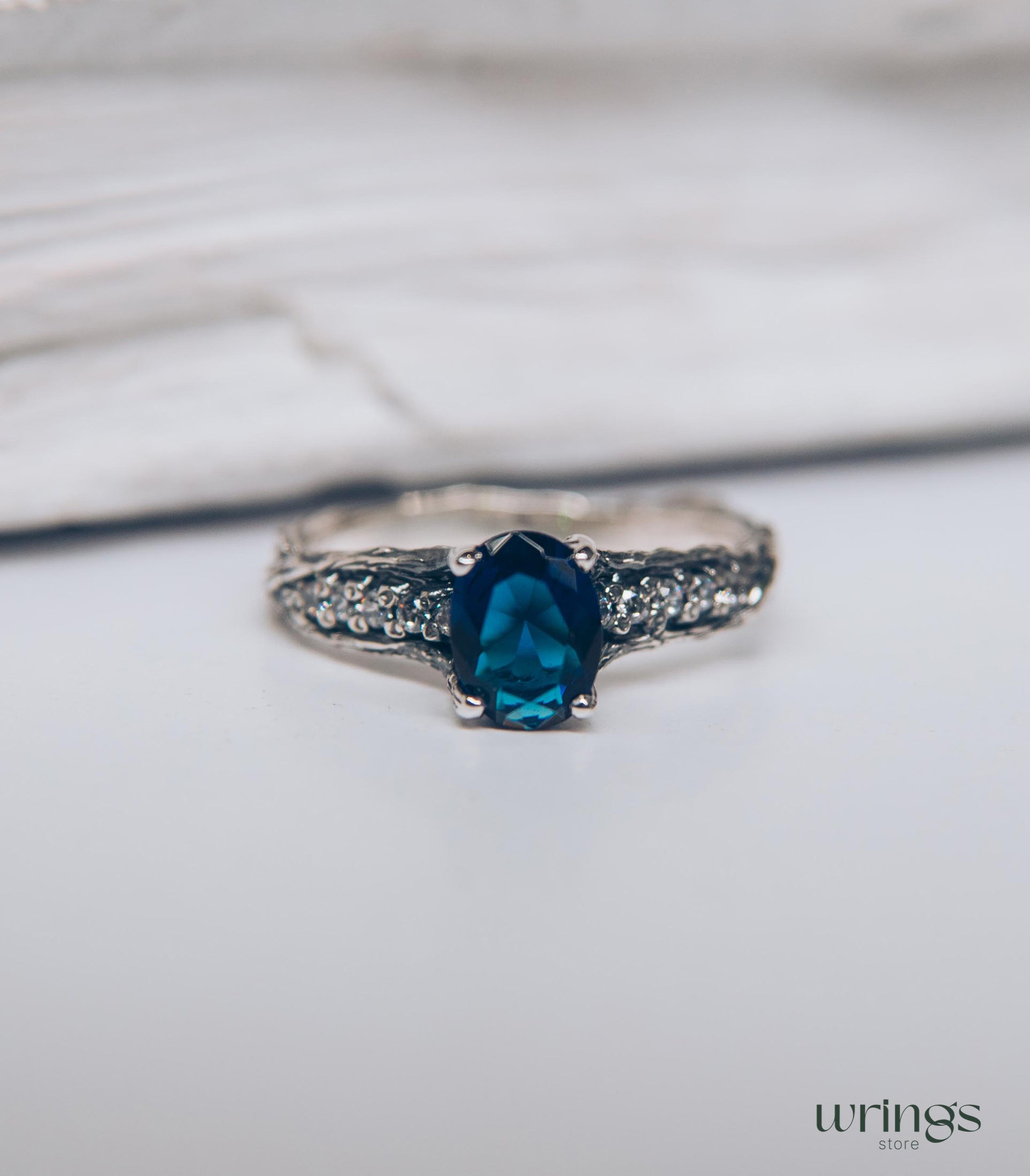 Dainty Oval Sapphire Ring – Side Stones on Silver Branch