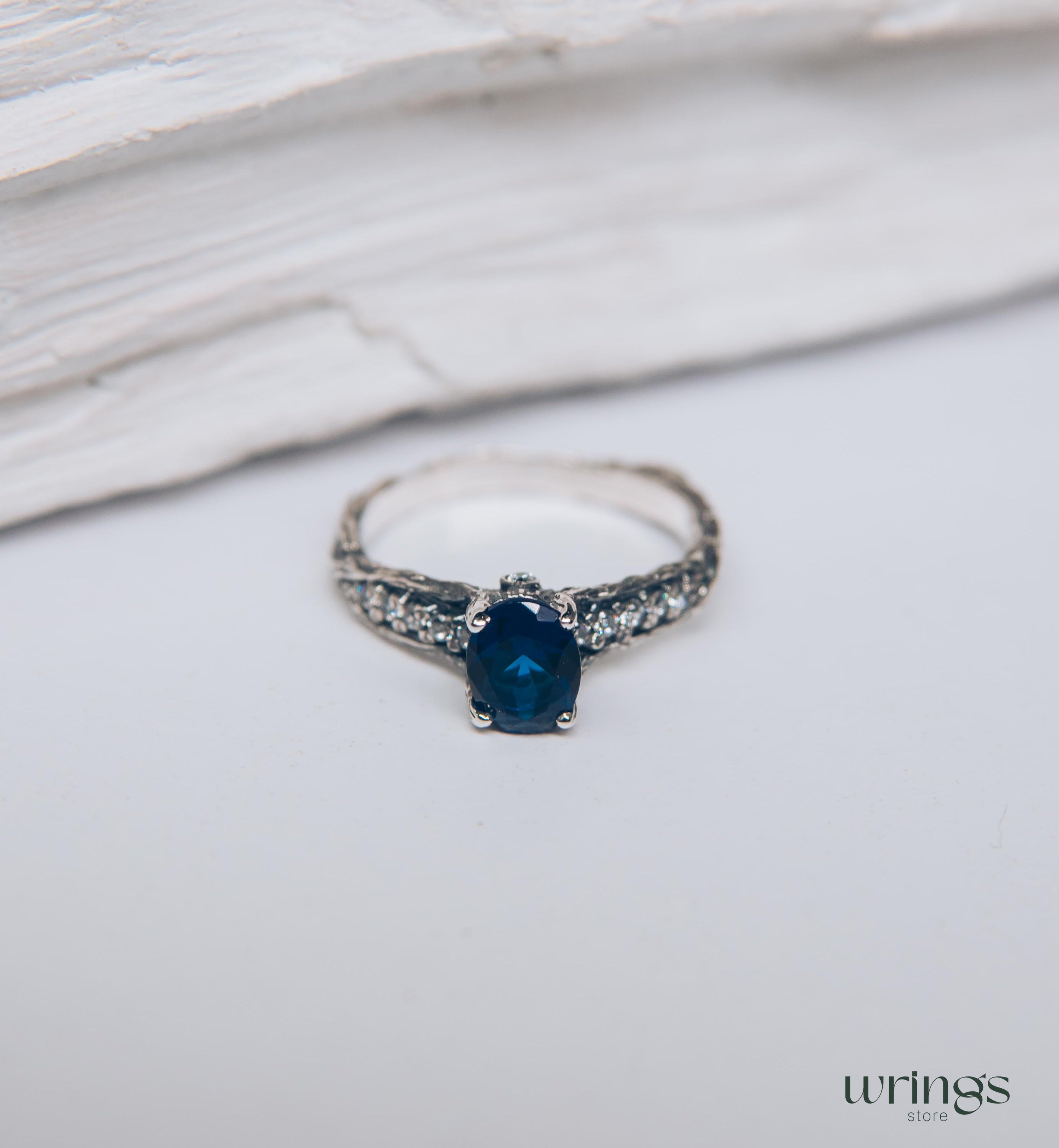 Dainty Oval Sapphire Ring – Side Stones on Silver Branch