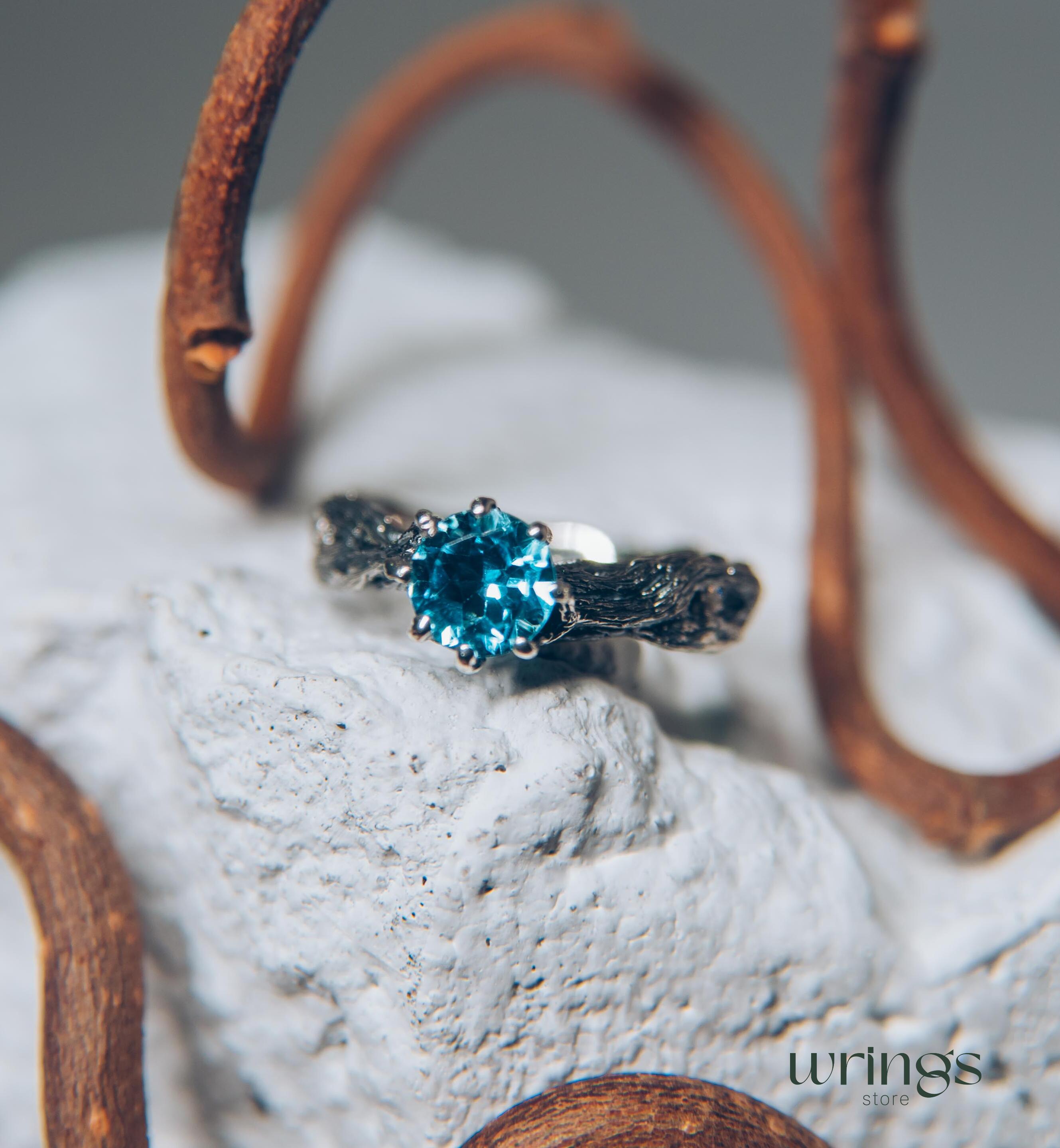 Vivid Topaz Engagement Ring with Silver Branch