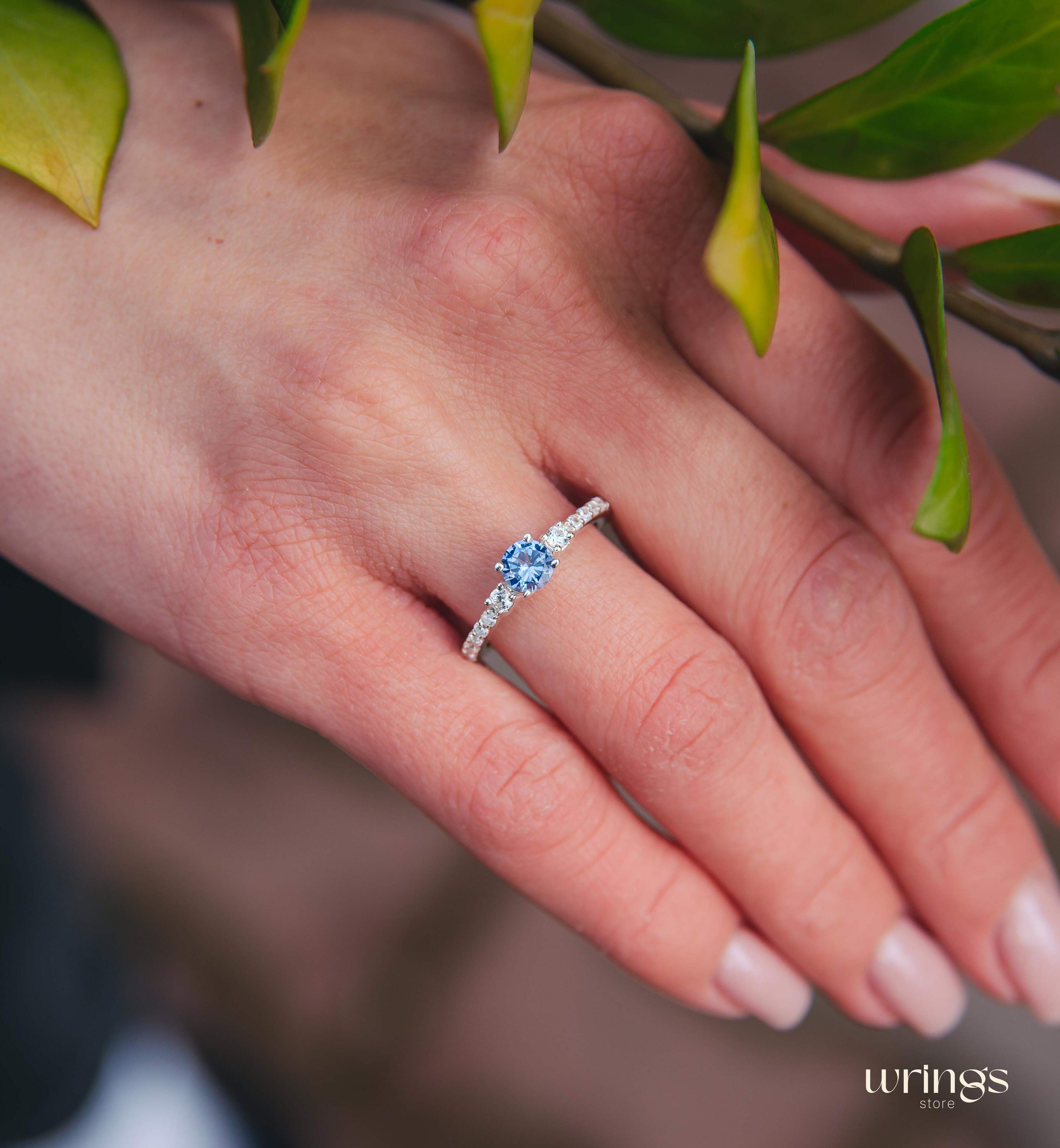 Tanzanite & CZ Side Stones Silver Engagement Ring