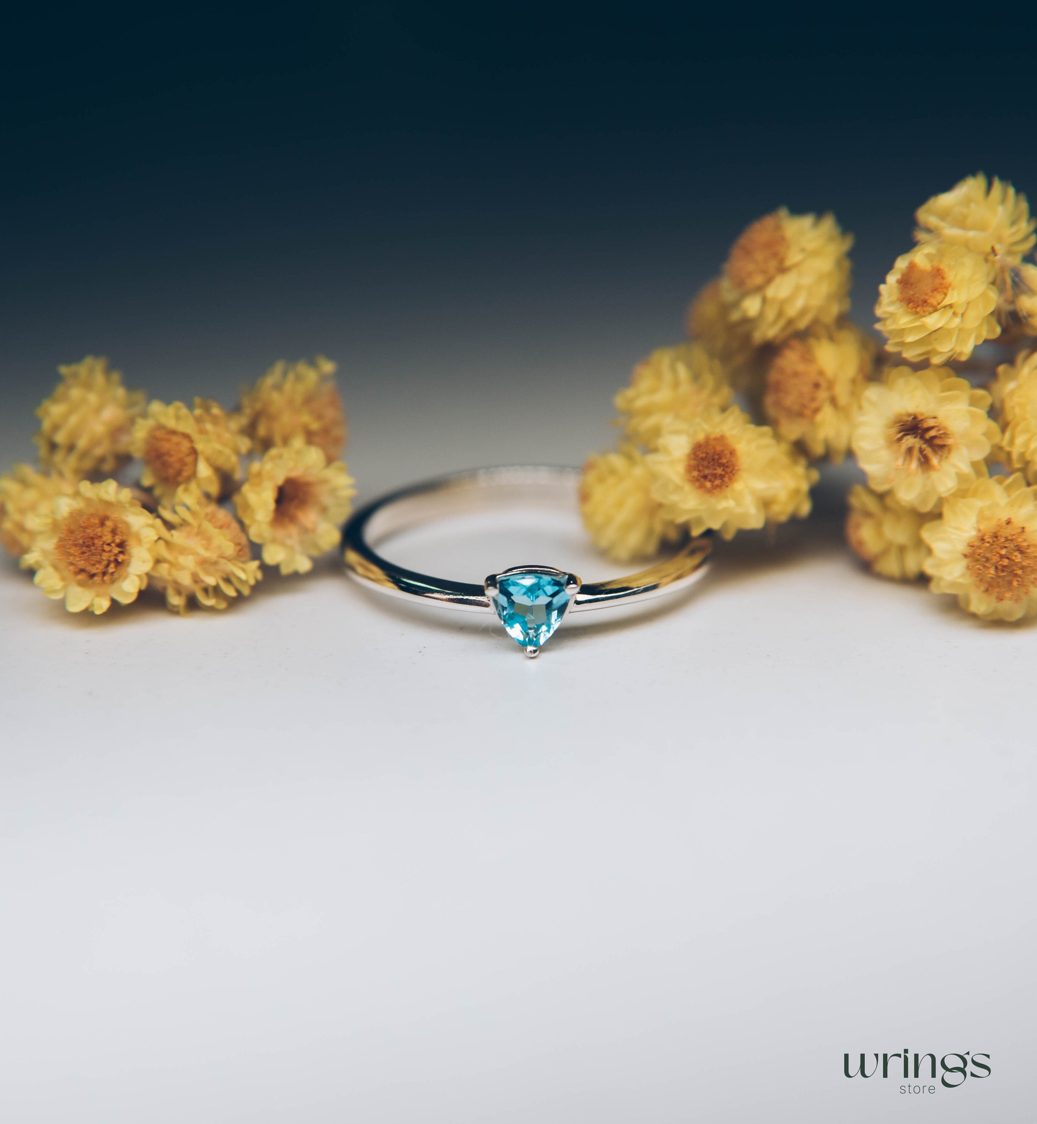 Blue Swiss Topaz Trillion Solitaire Ring in Silver