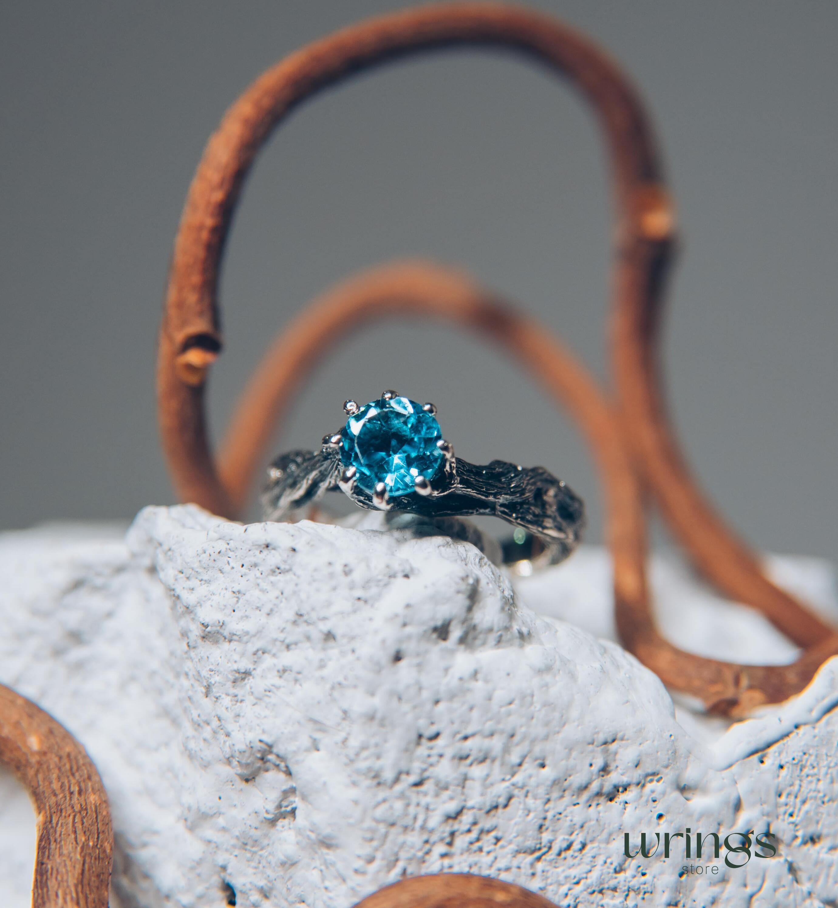 Vivid Topaz Engagement Ring with Silver Branch