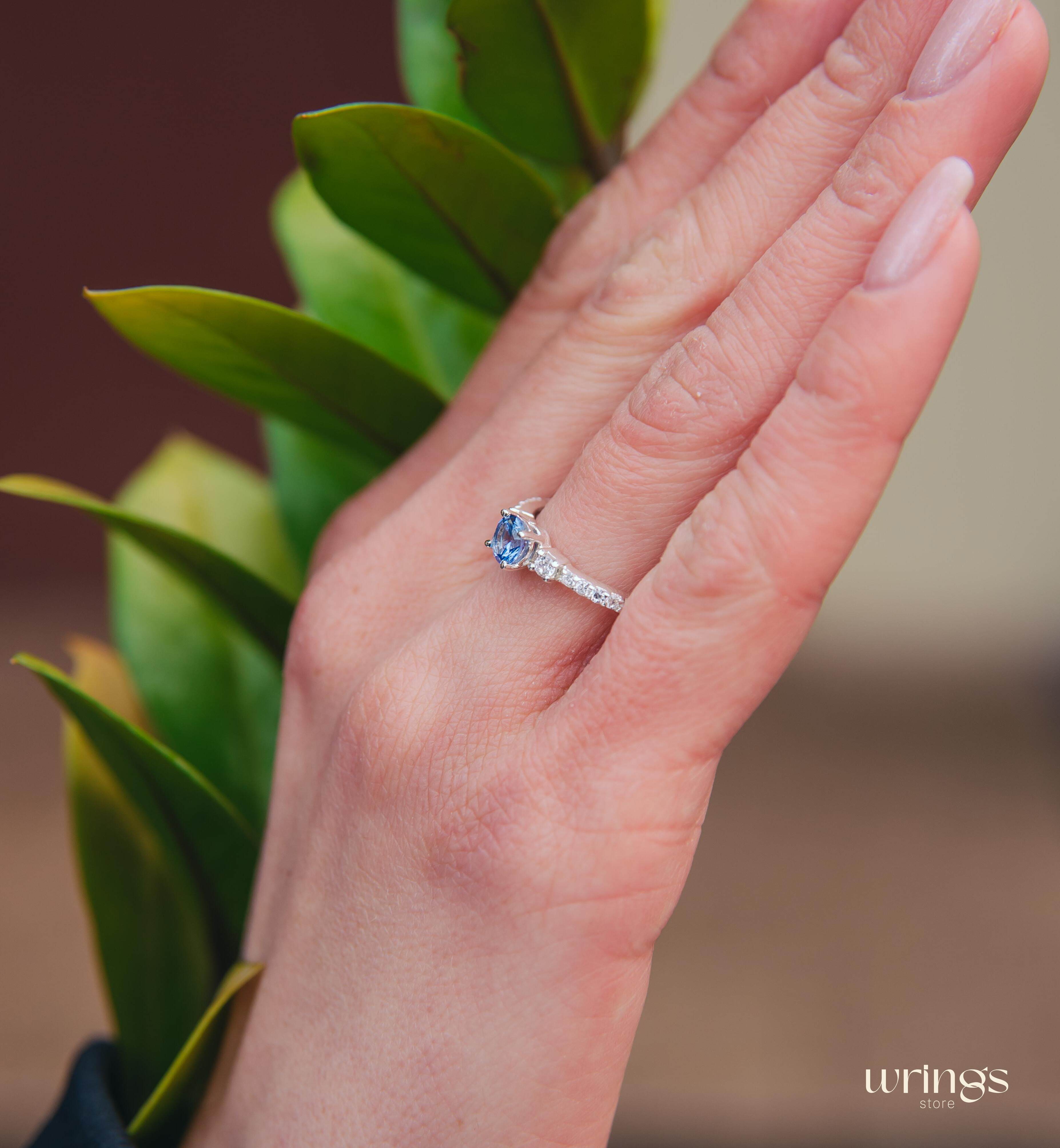 Tanzanite & CZ Side Stones Silver Engagement Ring