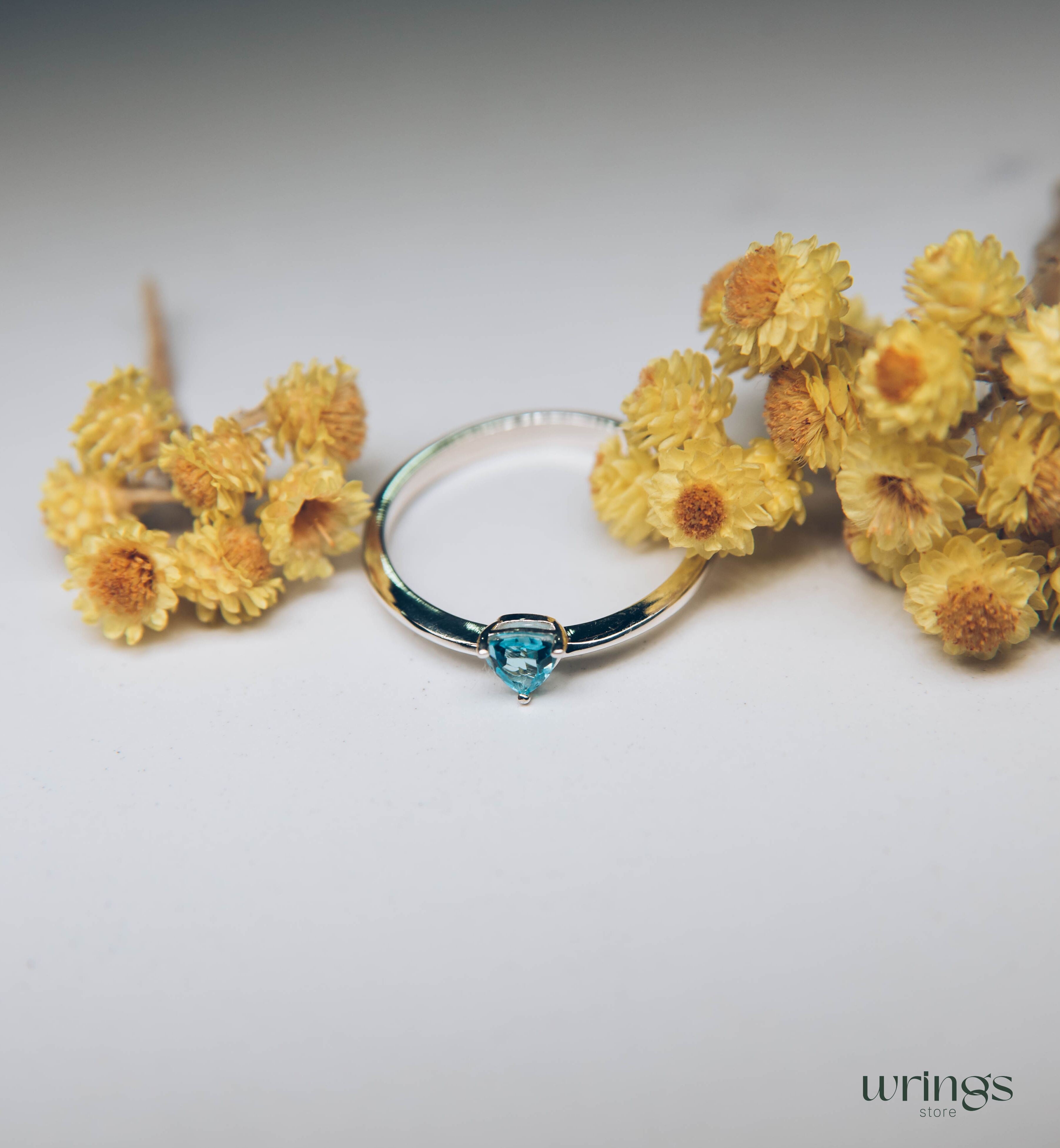 Blue Swiss Topaz Trillion Solitaire Ring in Silver