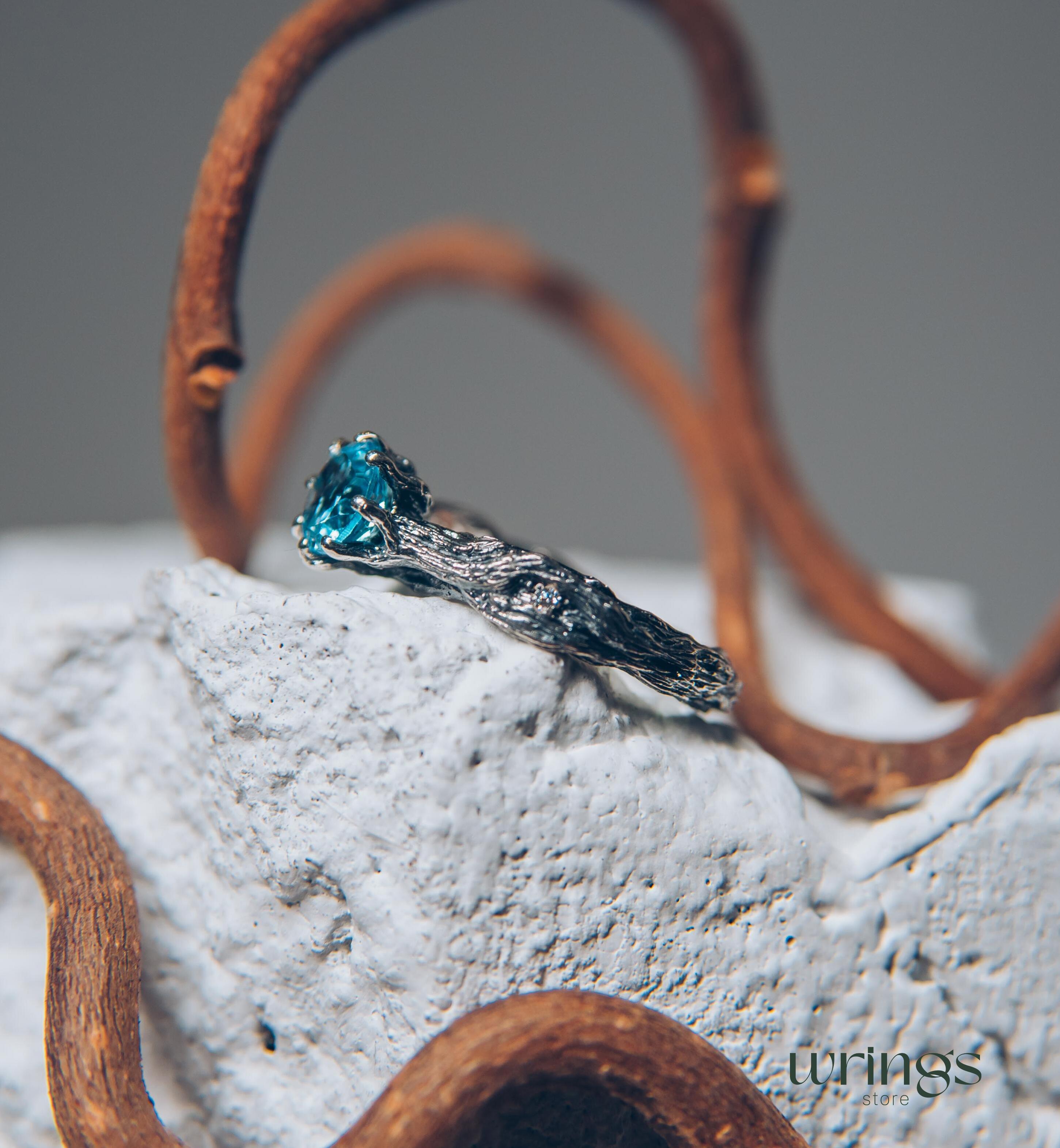 Vivid Topaz Engagement Ring with Silver Branch