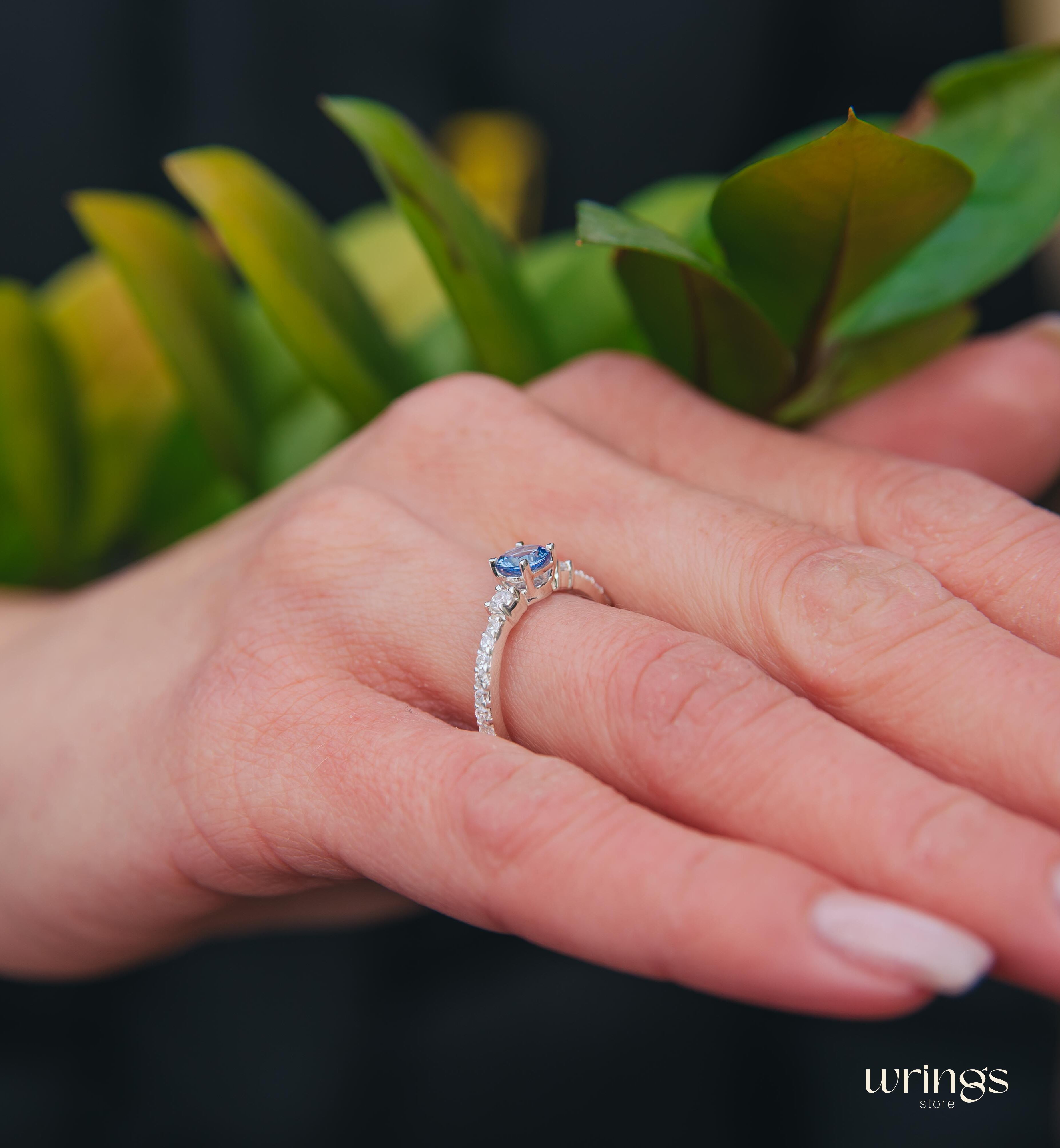 Tanzanite & CZ Side Stones Silver Engagement Ring