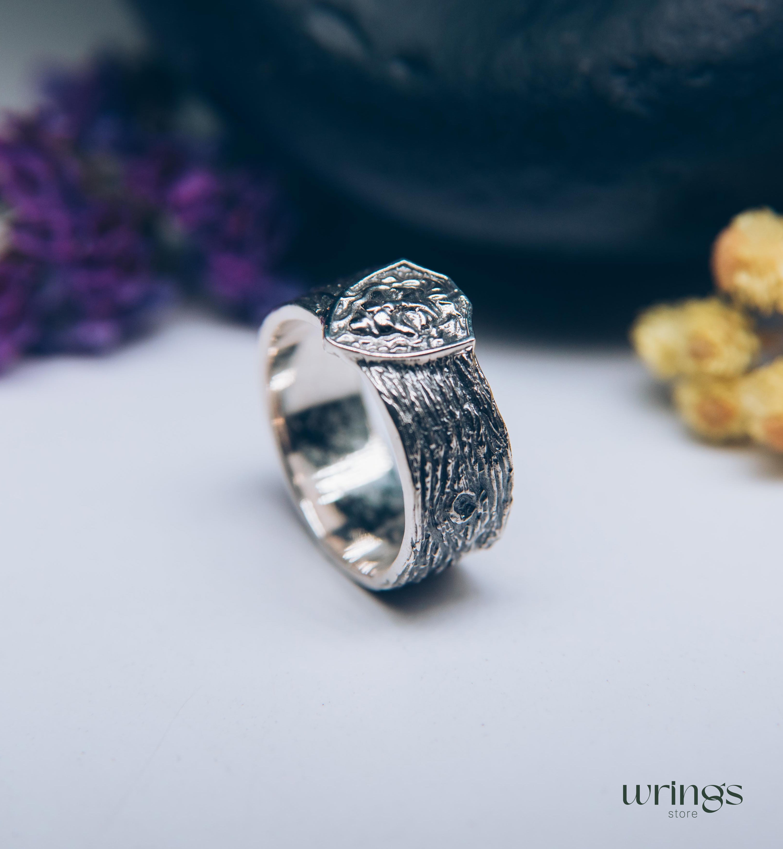 Unique Solid Silver Lion head Ring for Men placed in a Shield