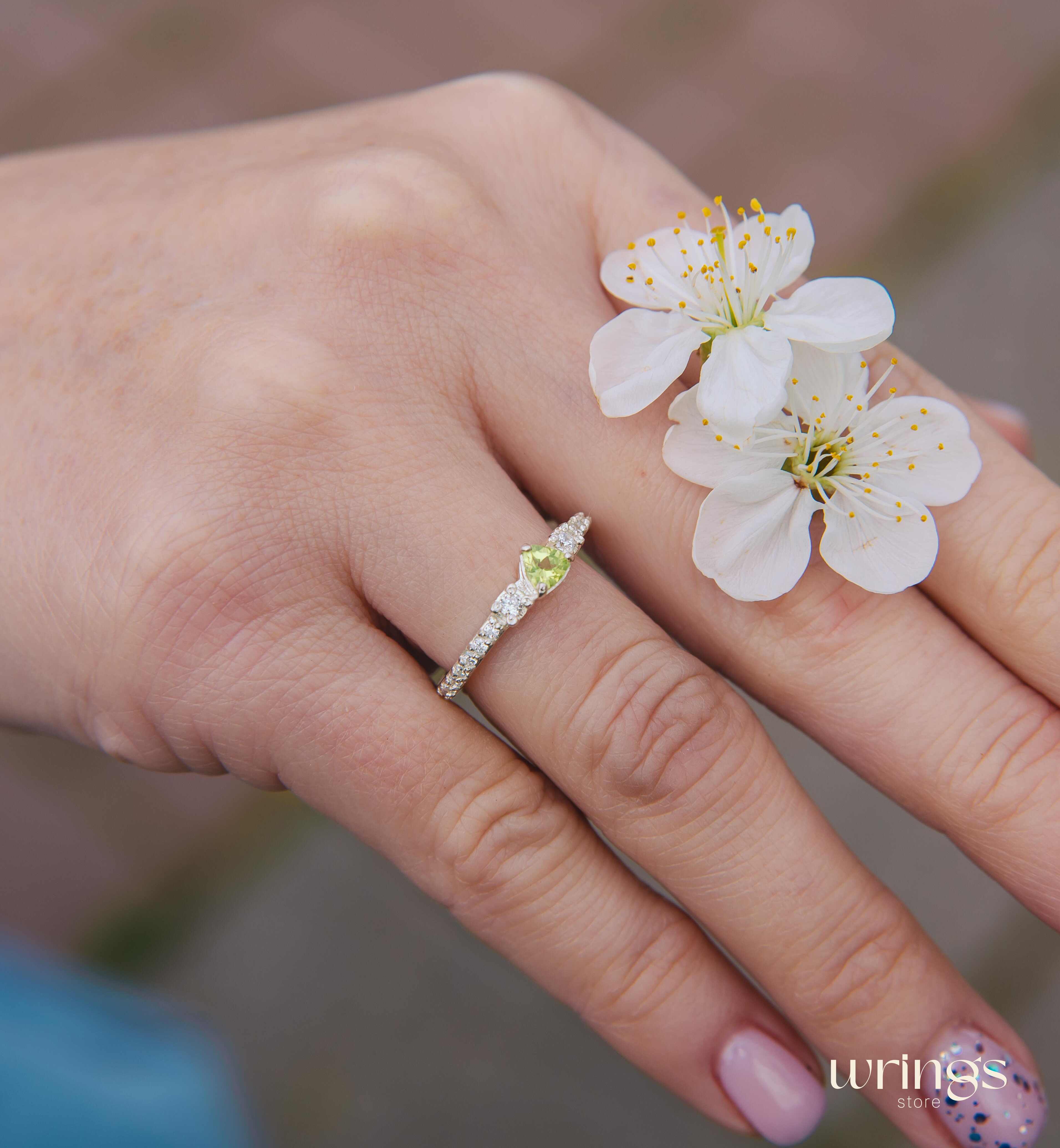 Small Central Peridot Three Stone Engagement Ring