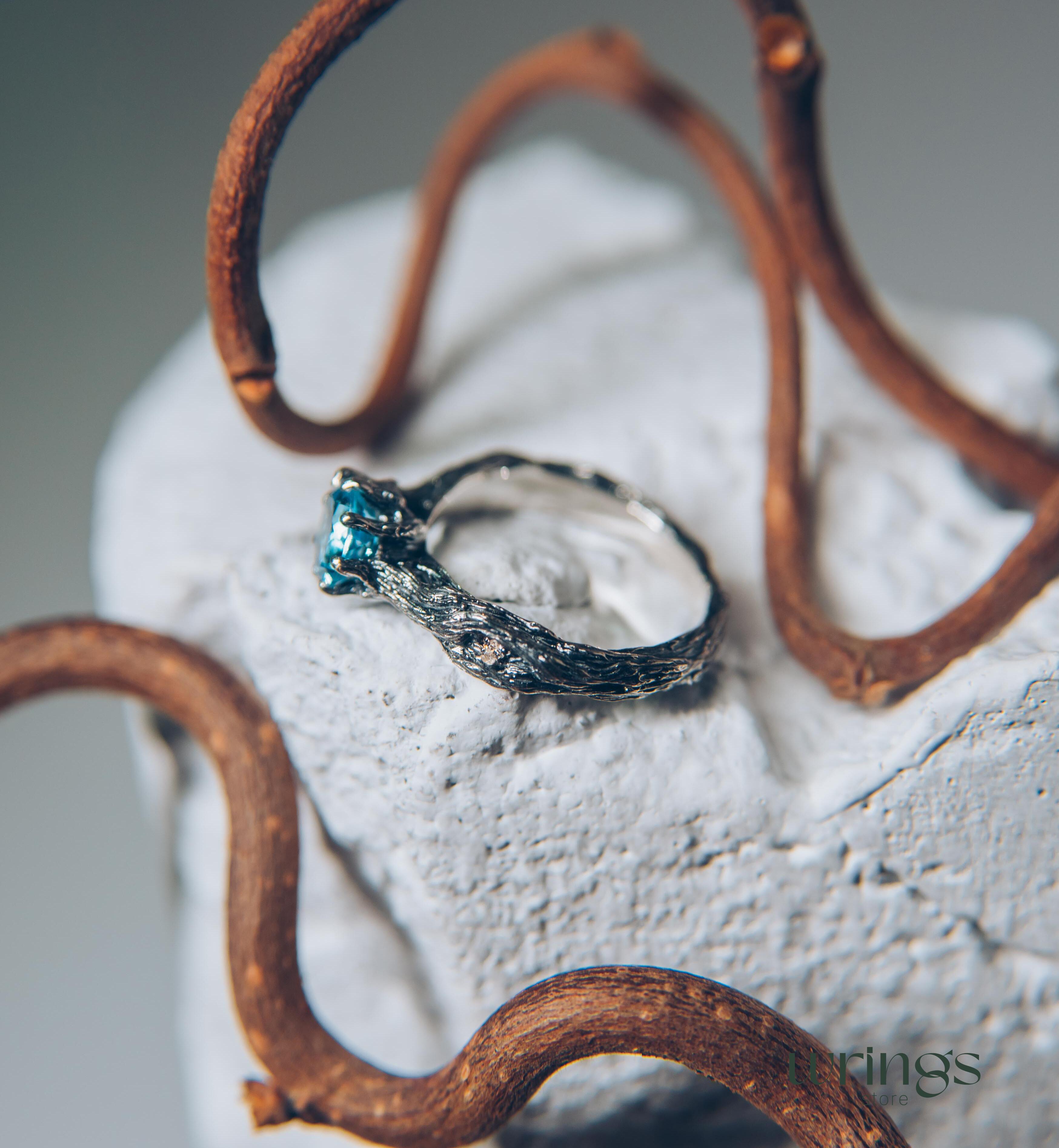 Vivid Topaz Engagement Ring with Silver Branch