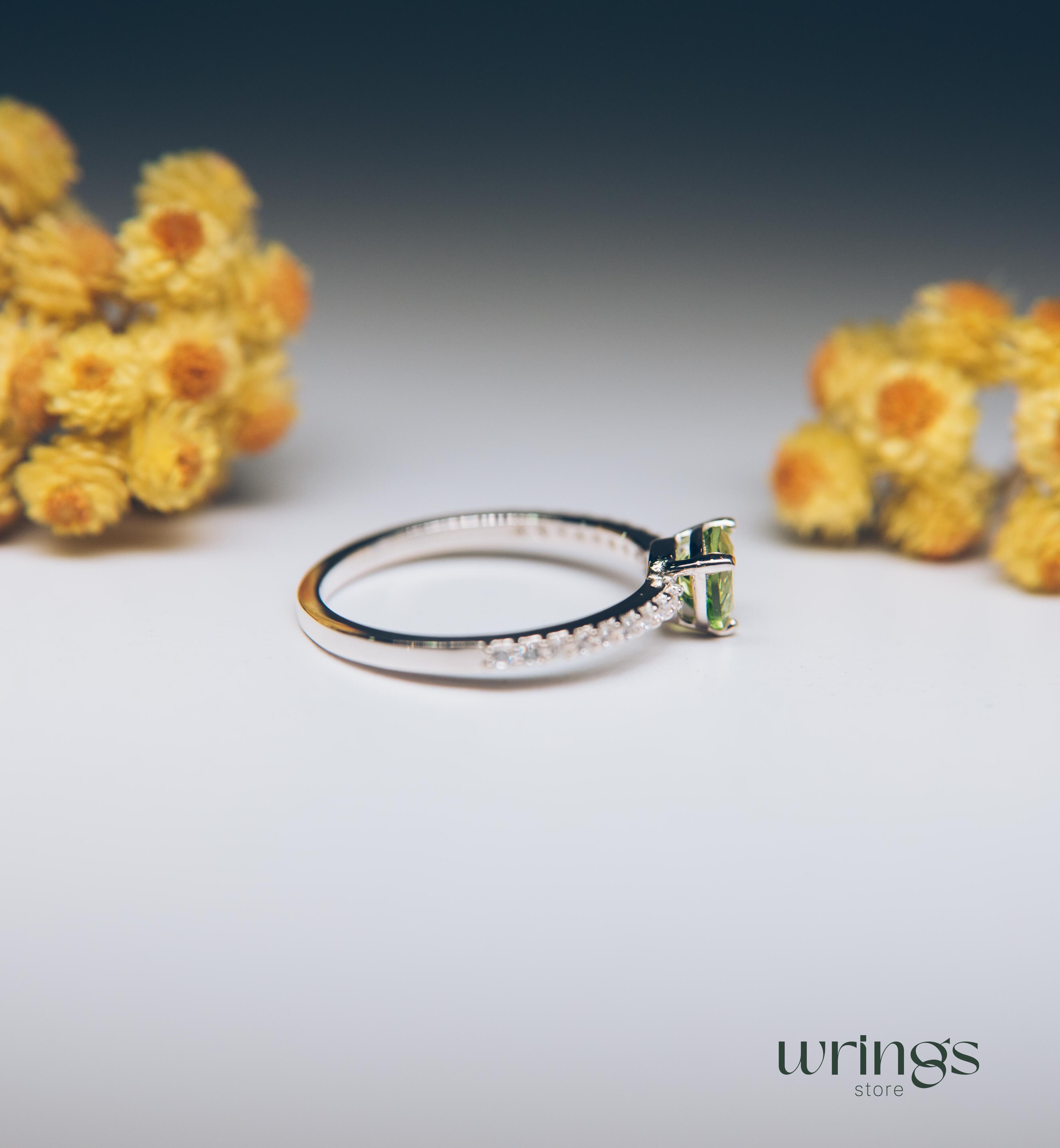 Trilliant Peridot Engagement Ring & CZ Side Stones