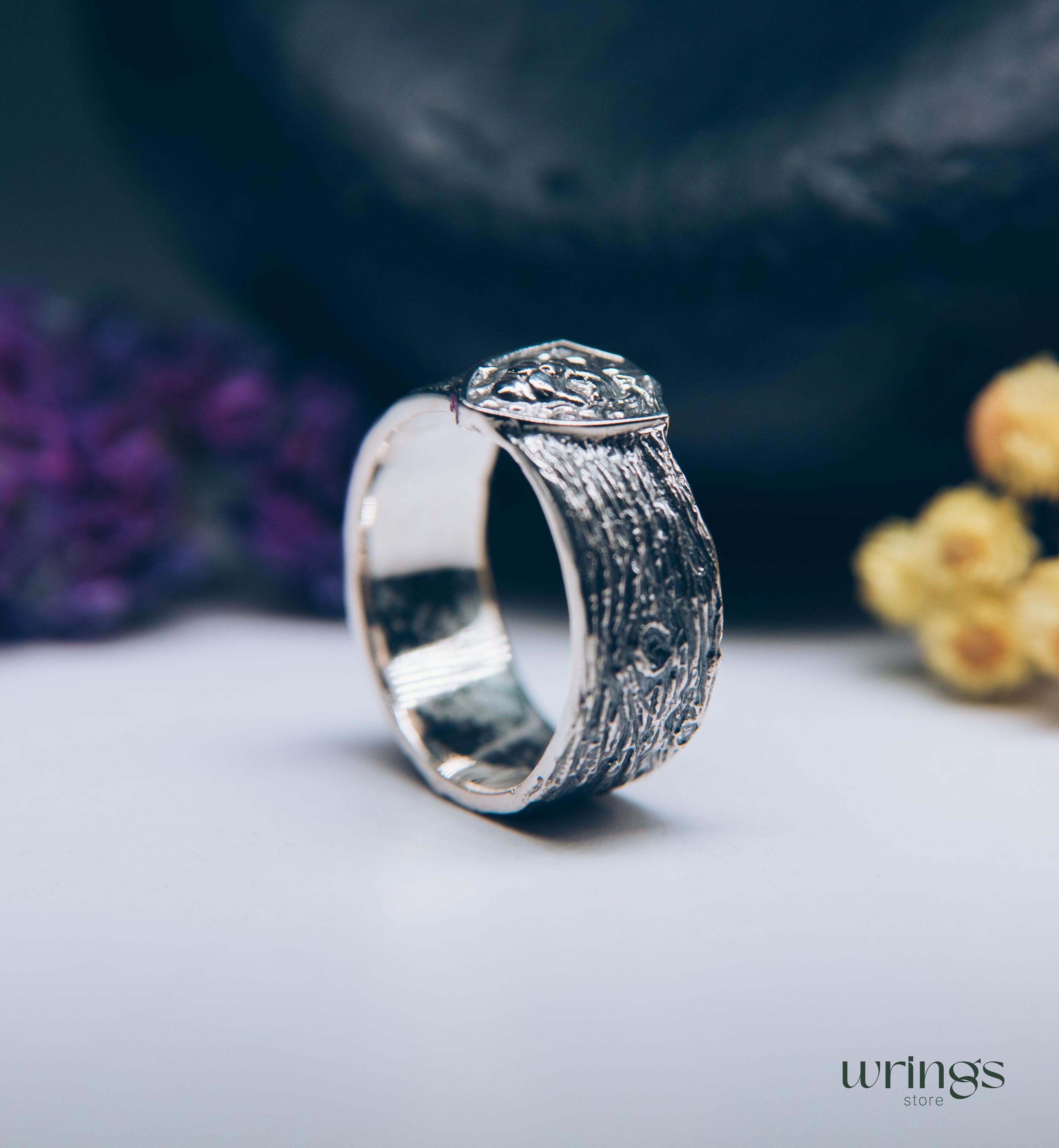 Unique Solid Silver Lion head Ring for Men placed in a Shield