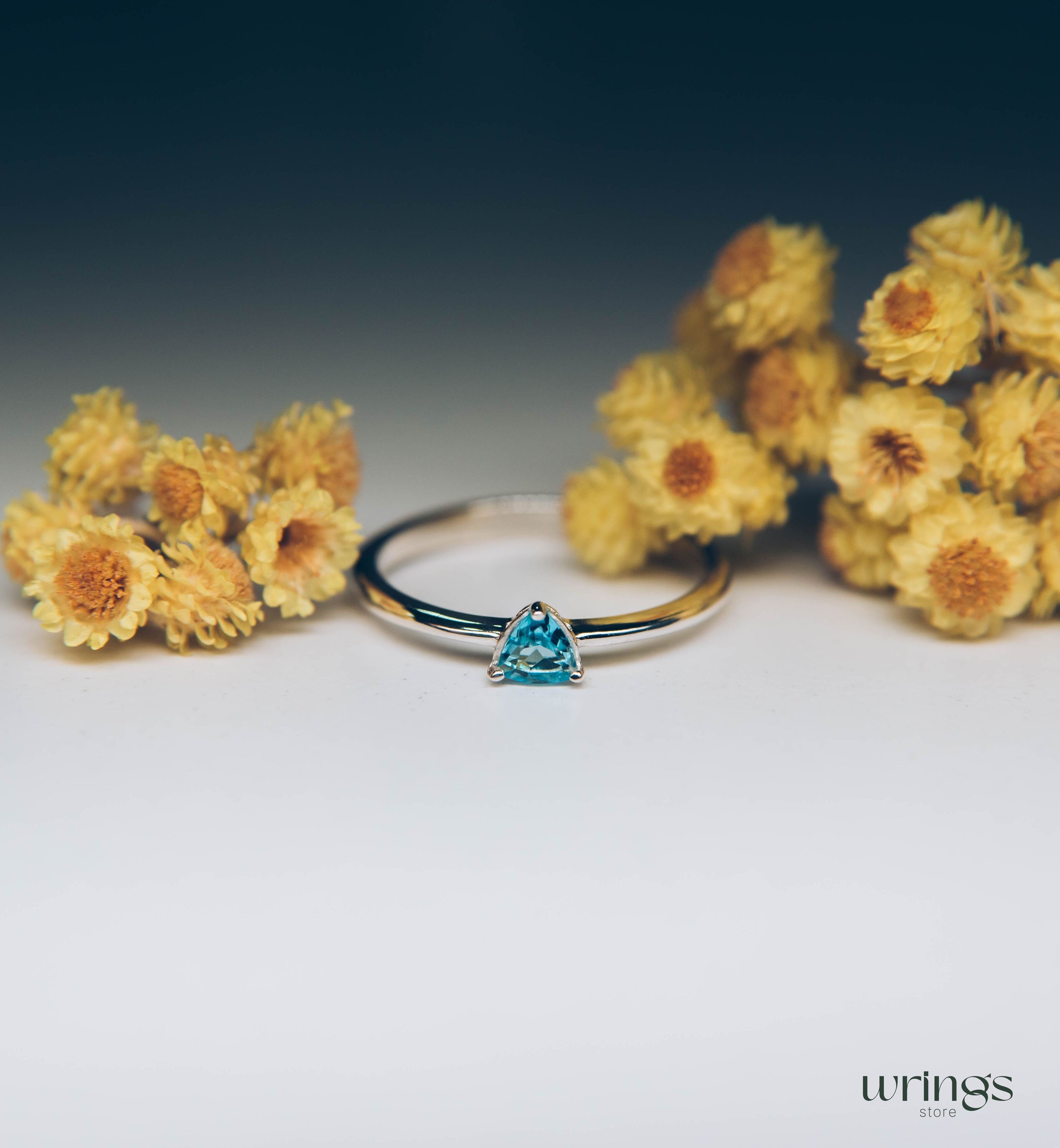 Blue Swiss Topaz Trillion Solitaire Ring in Silver