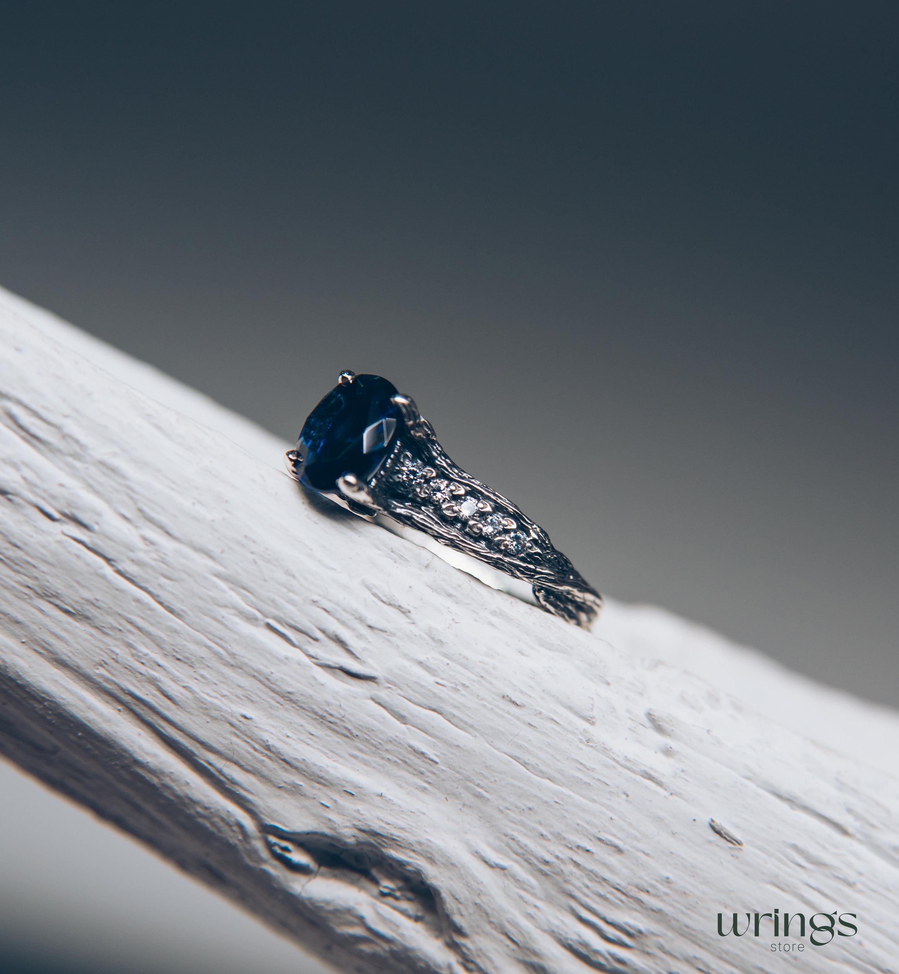 Dainty Oval Sapphire Ring – Side Stones on Silver Branch