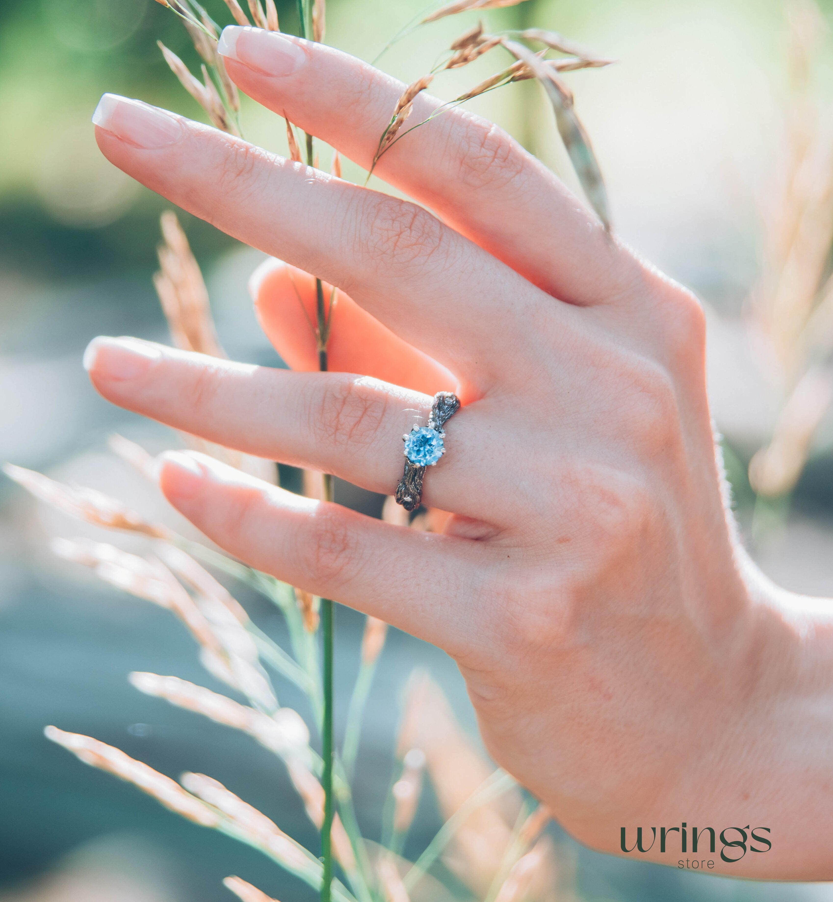 Vivid Topaz Engagement Ring with Silver Branch