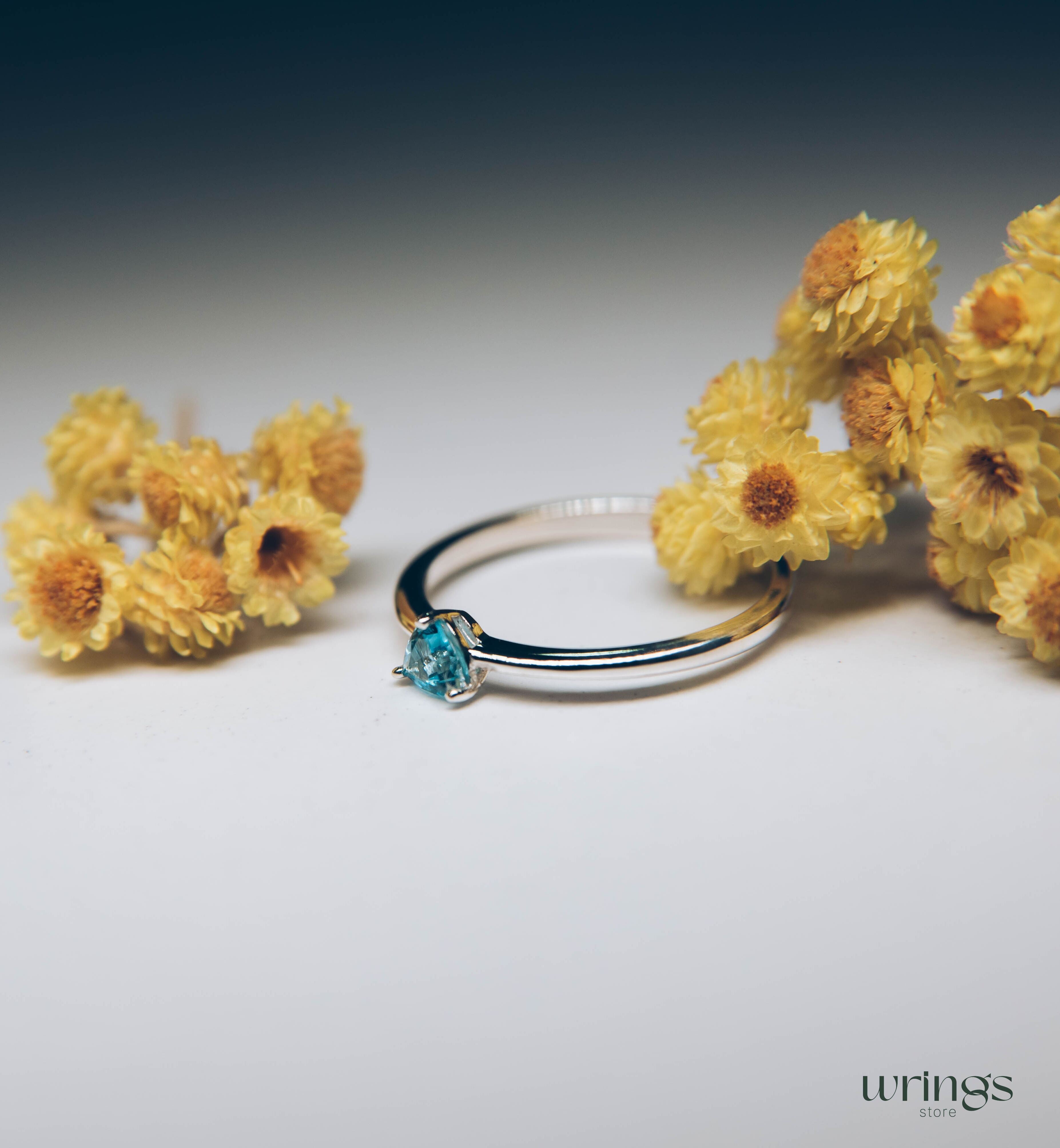 Blue Swiss Topaz Trillion Solitaire Ring in Silver