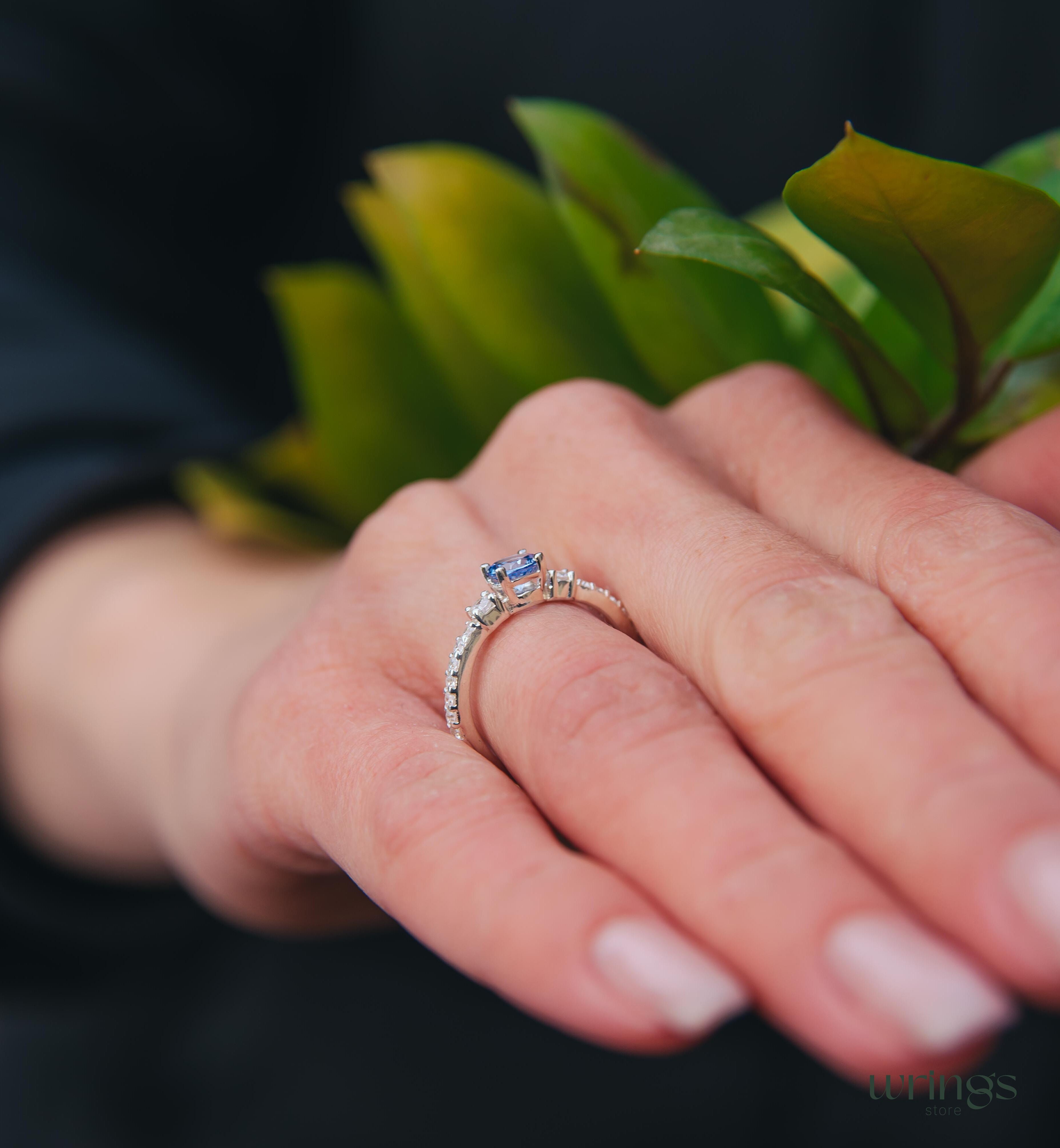 Tanzanite & CZ Side Stones Silver Engagement Ring