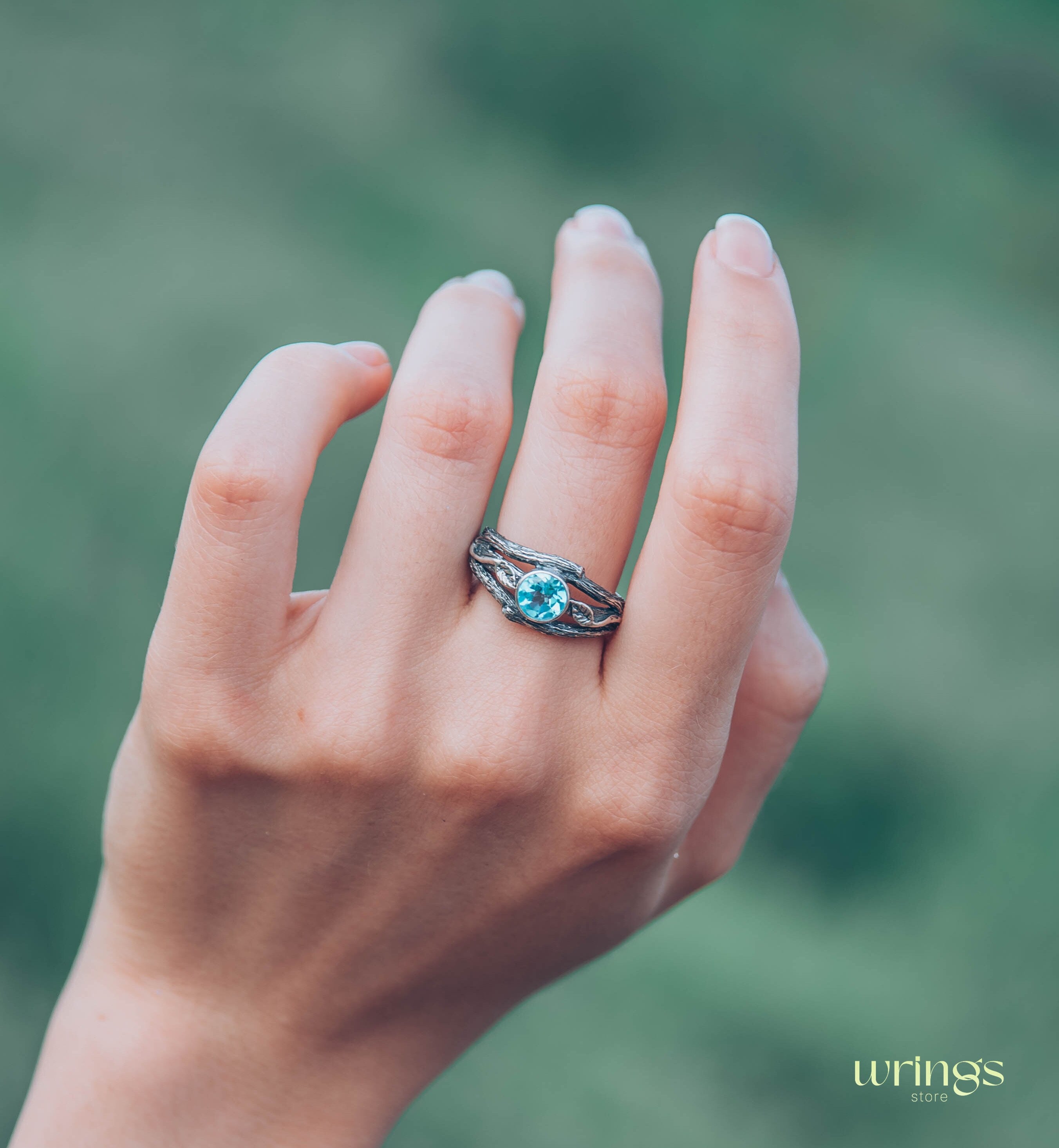 Bezel Set Topaz Ring with Leaves on a Silver Magic Twig