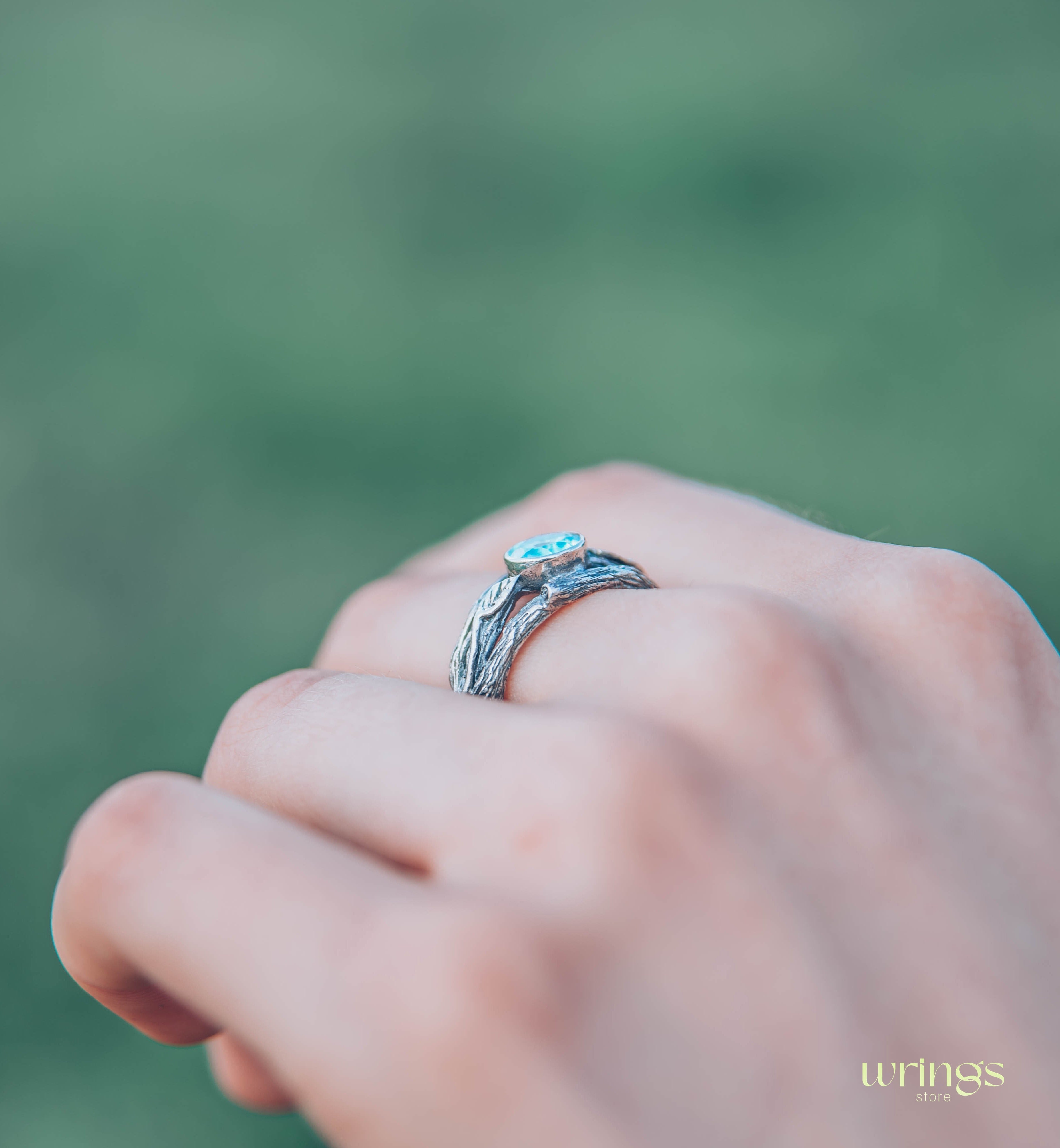 Bezel Set Topaz Ring with Leaves on a Silver Magic Twig