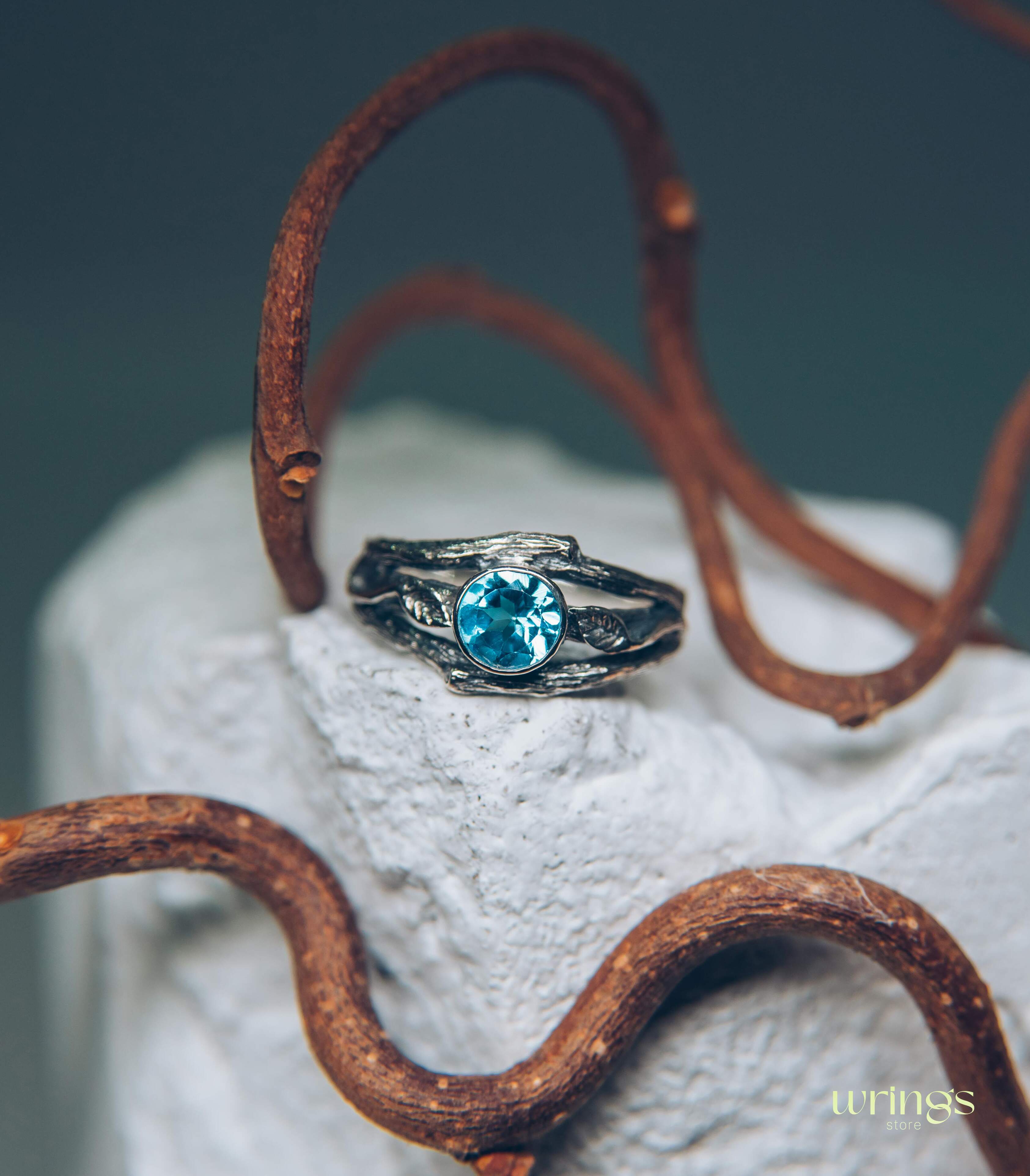 Bezel Set Topaz Ring with Leaves on a Silver Magic Twig