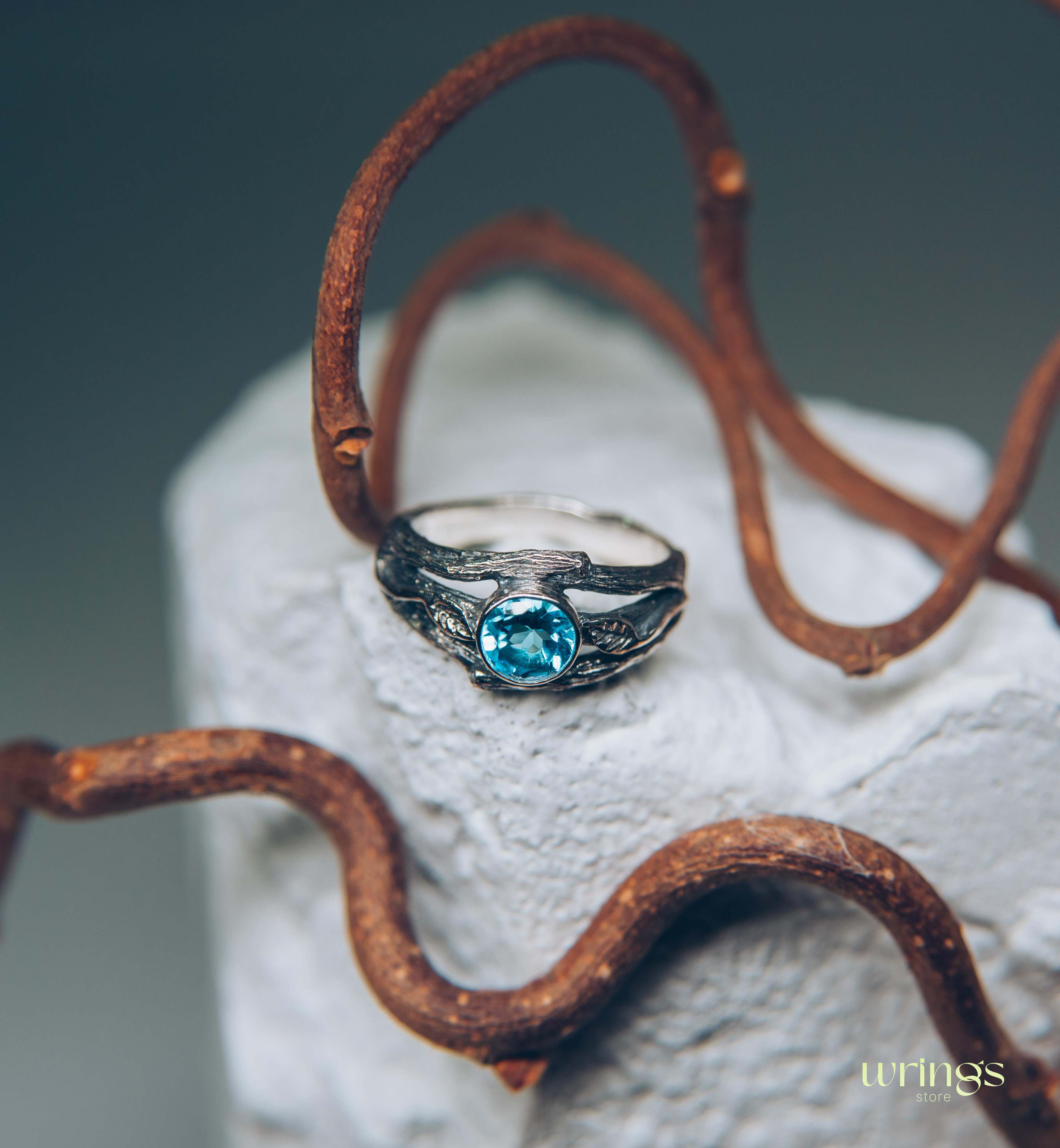 Bezel Set Topaz Ring with Leaves on a Silver Magic Twig