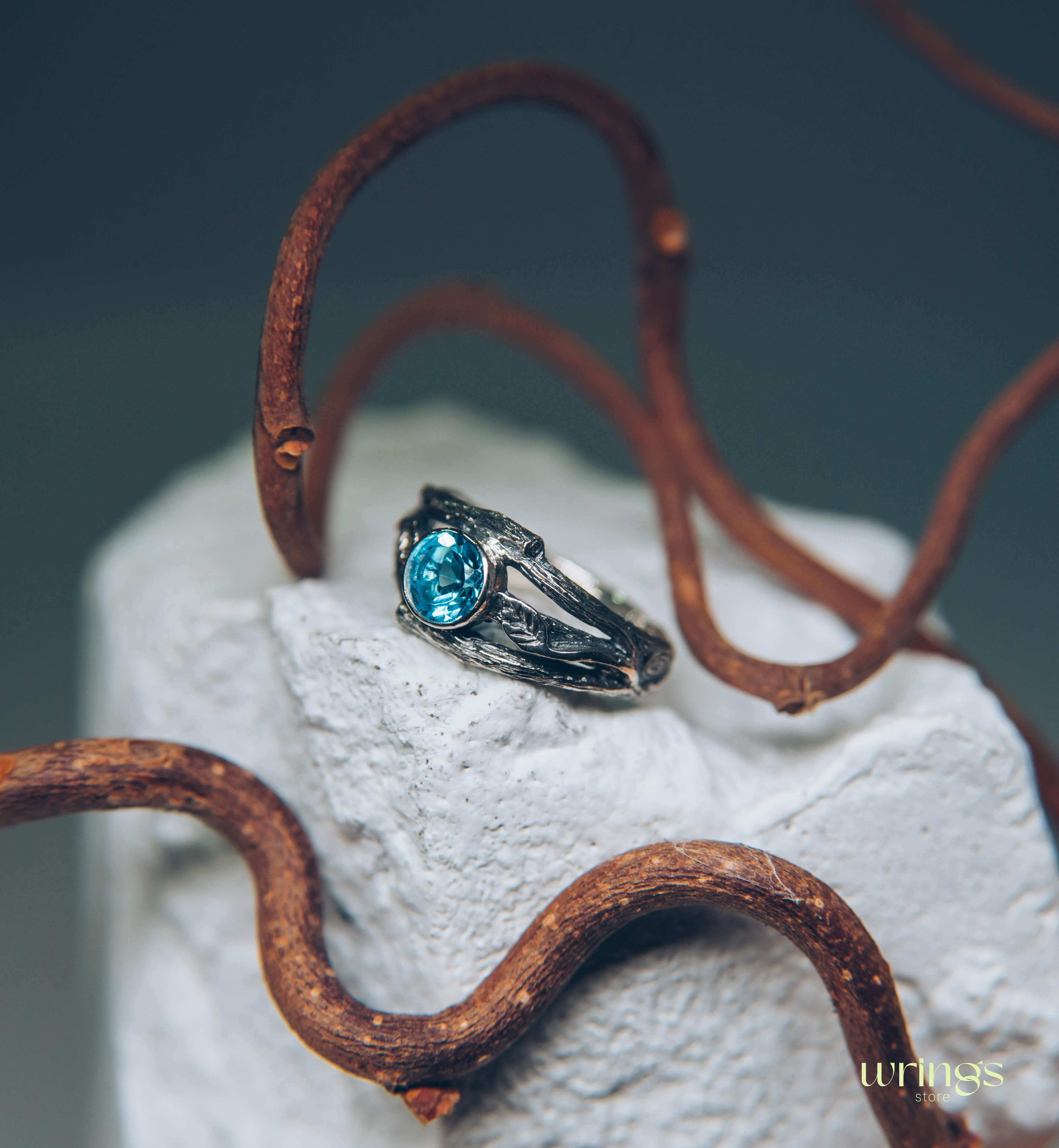 Bezel Set Topaz Ring with Leaves on a Silver Magic Twig