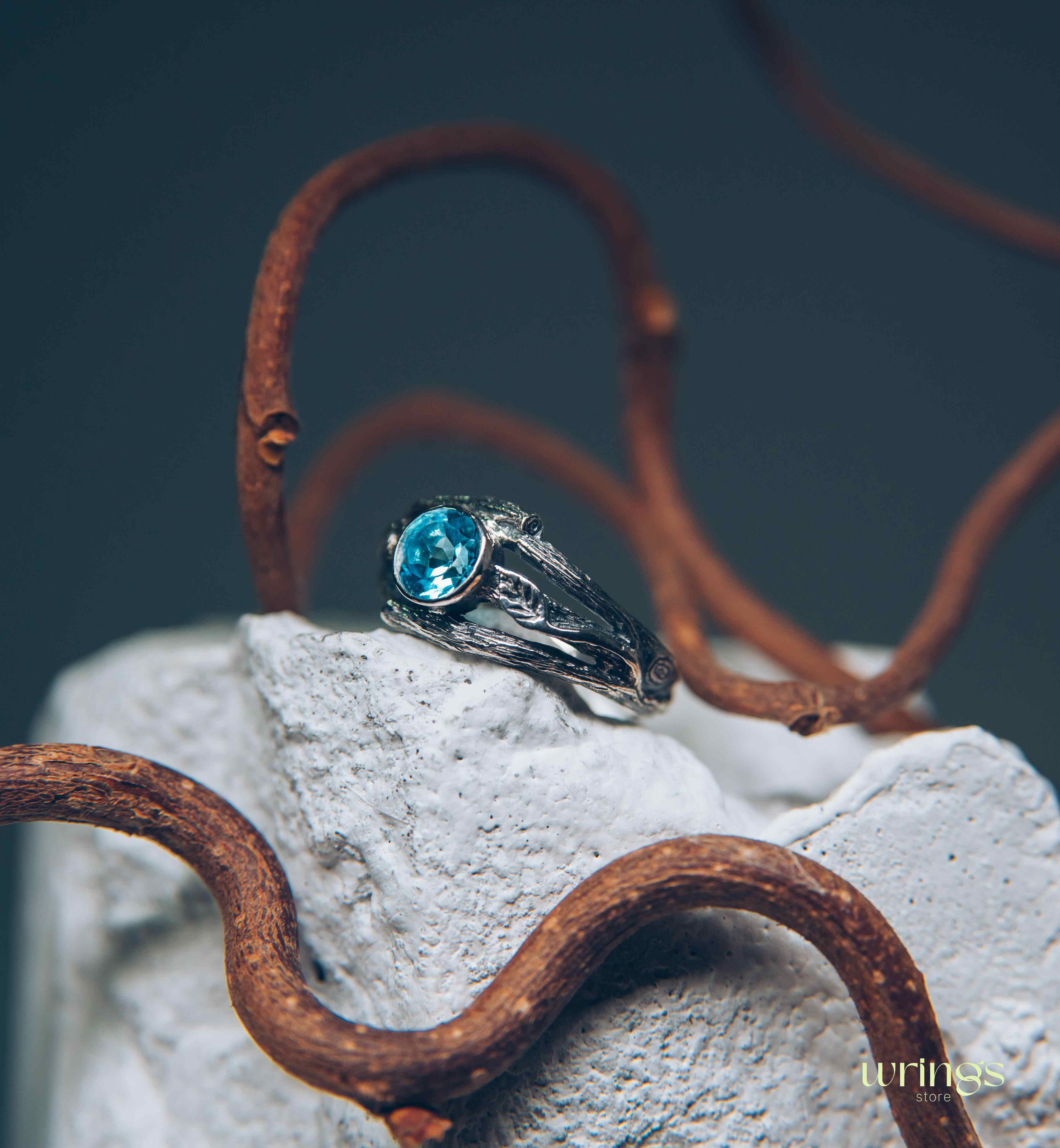 Bezel Set Topaz Ring with Leaves on a Silver Magic Twig