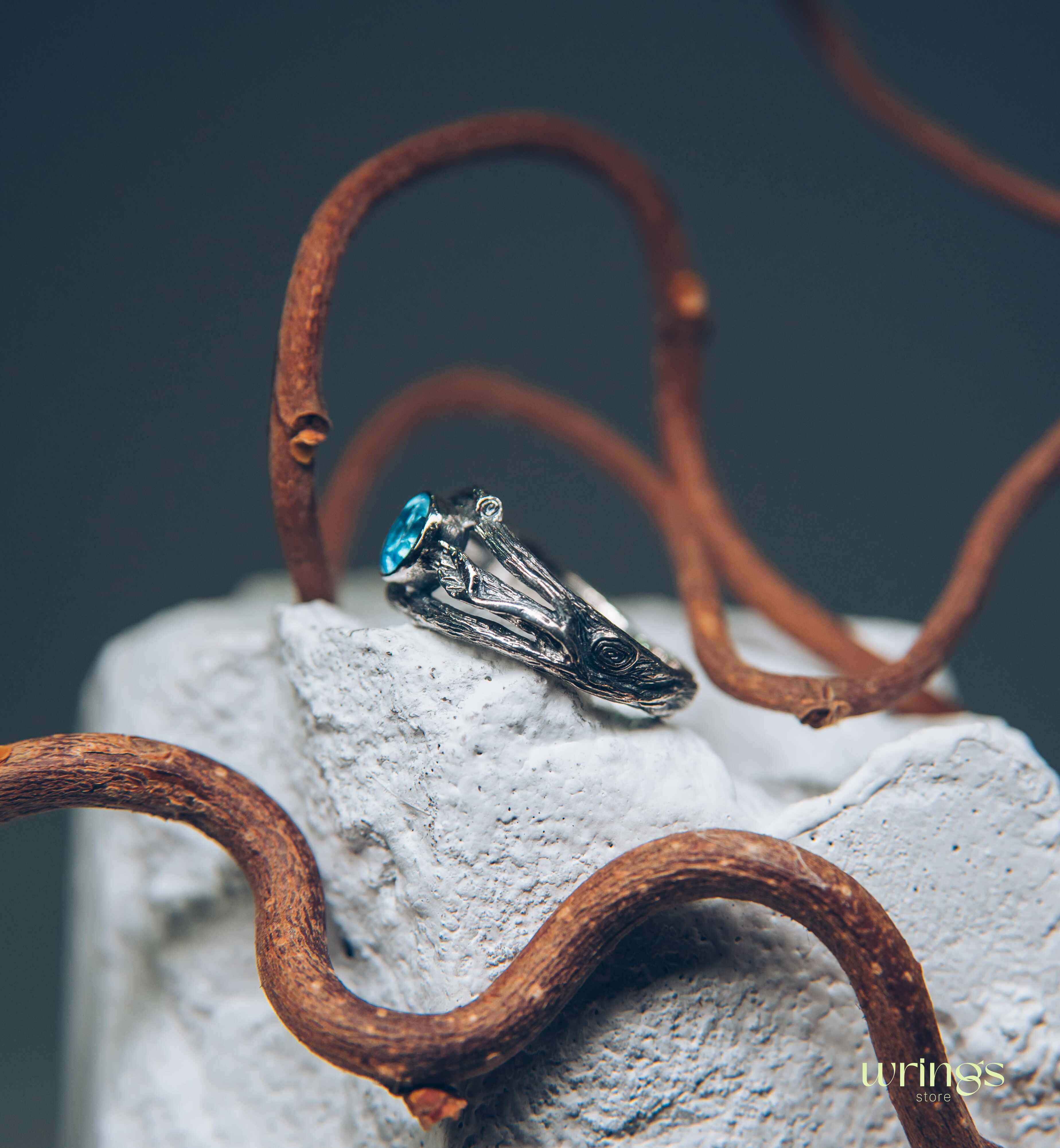 Bezel Set Topaz Ring with Leaves on a Silver Magic Twig