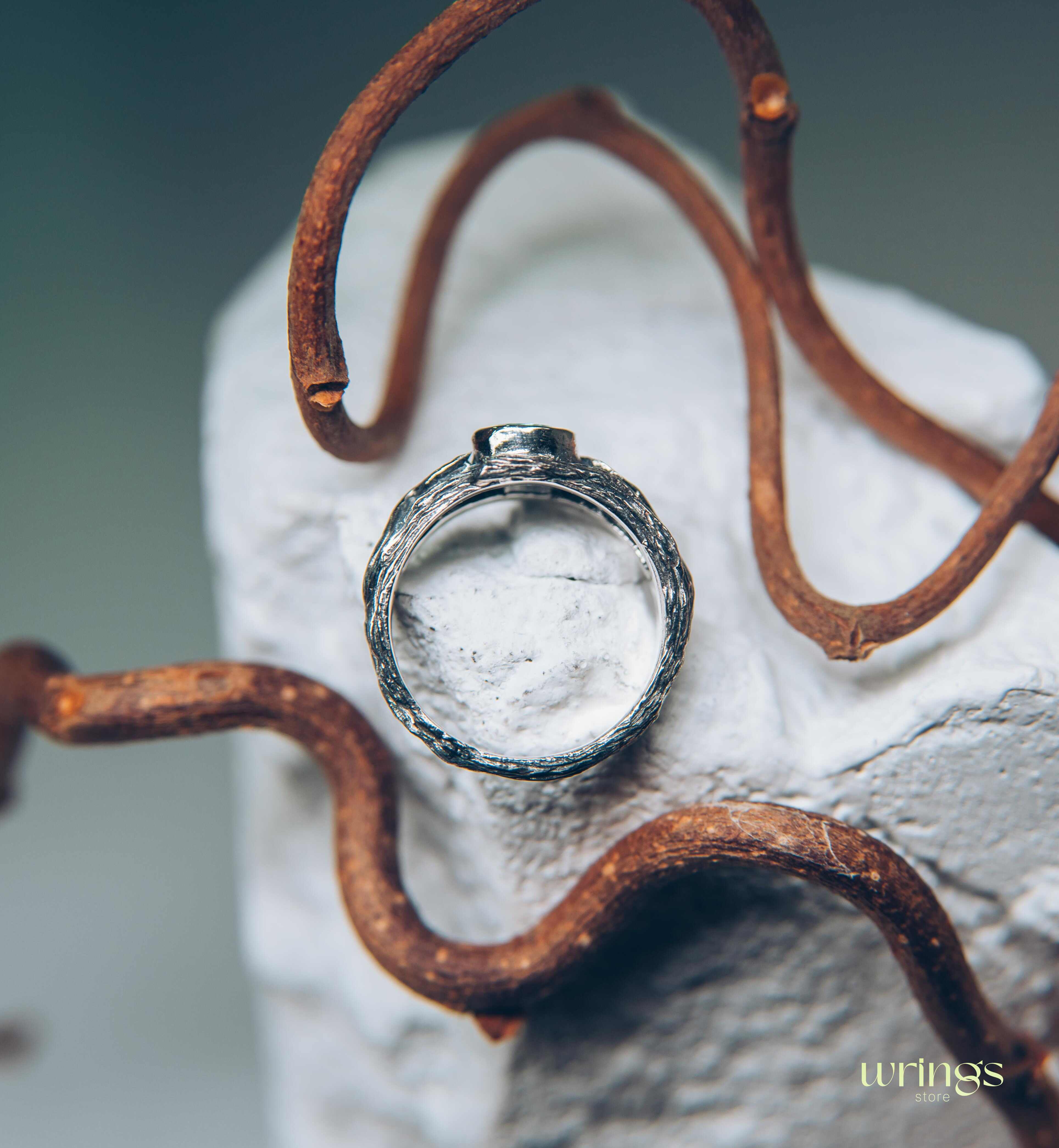 Bezel Set Topaz Ring with Leaves on a Silver Magic Twig