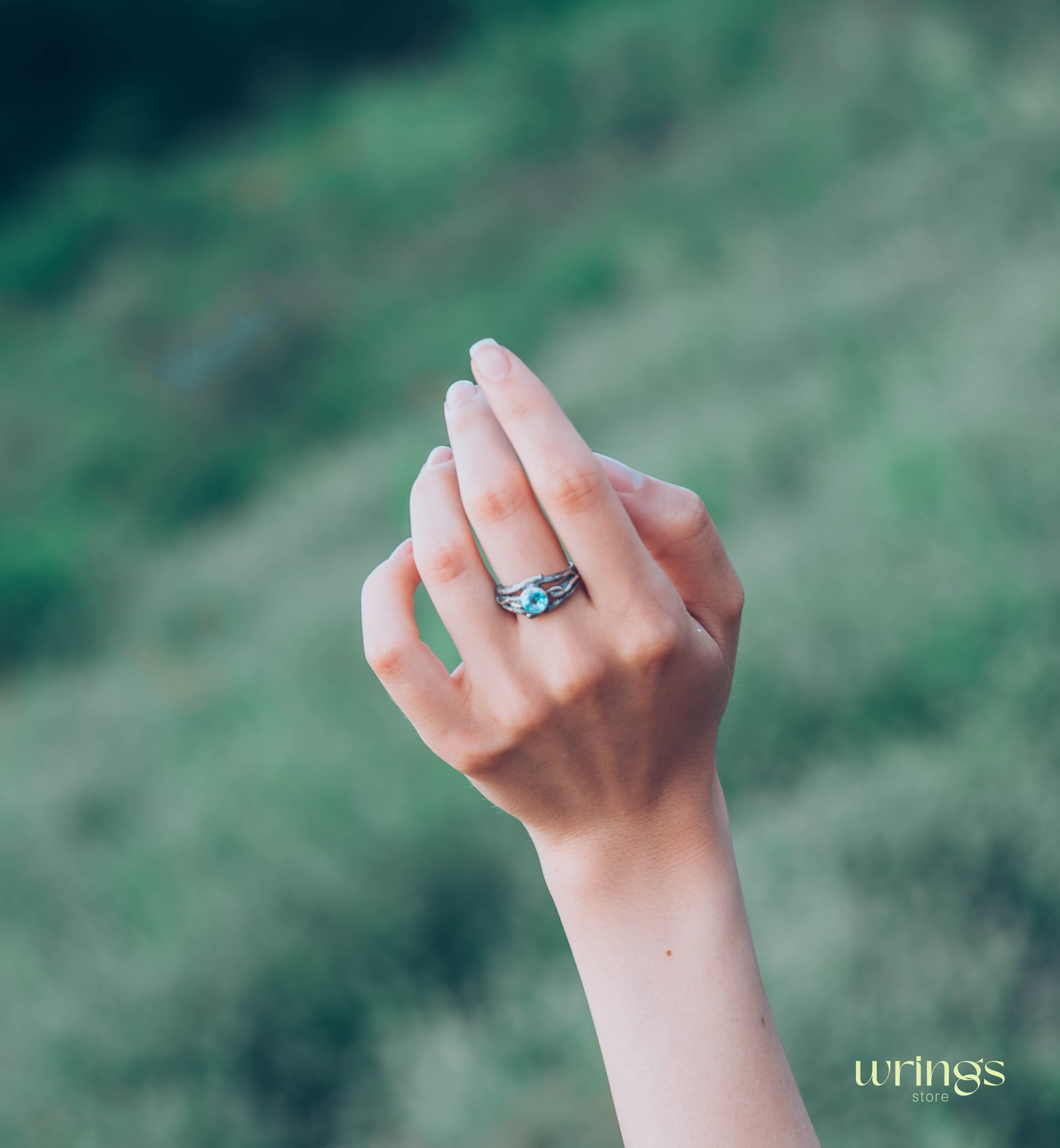 Bezel Set Topaz Ring with Leaves on a Silver Magic Twig