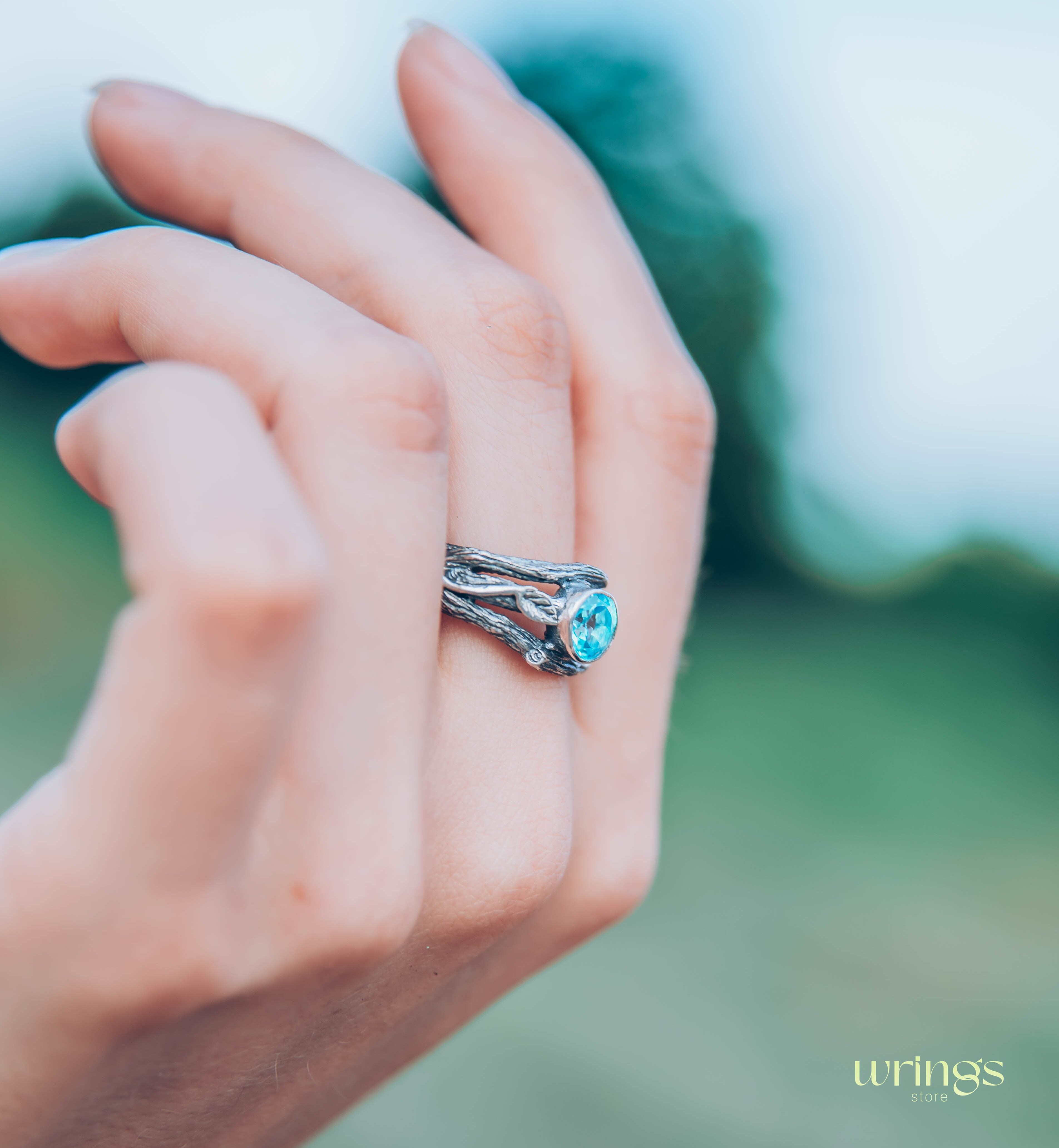 Bezel Set Topaz Ring with Leaves on a Silver Magic Twig