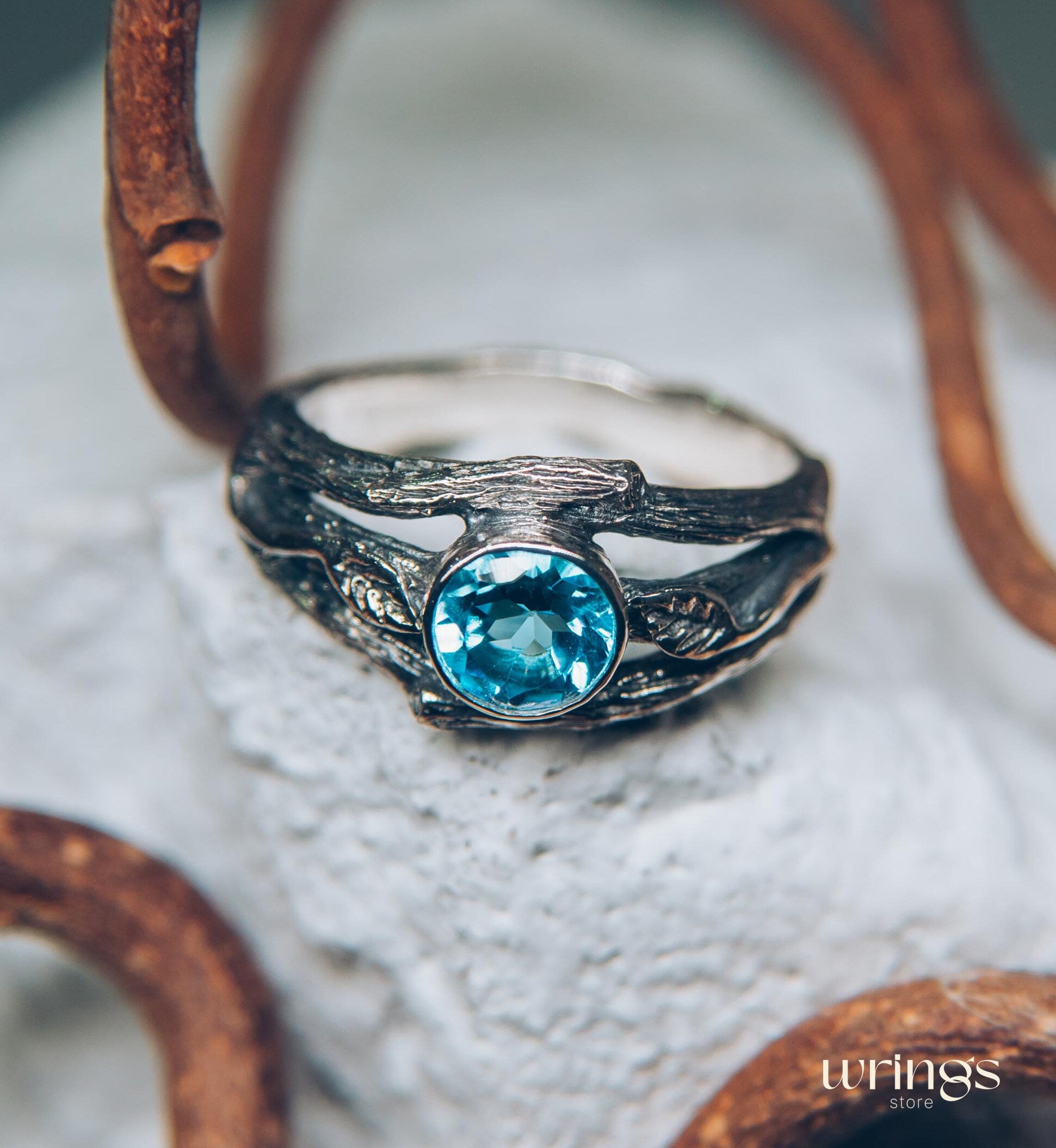 Bezel Set Topaz Ring with Leaves on a Silver Magic Twig