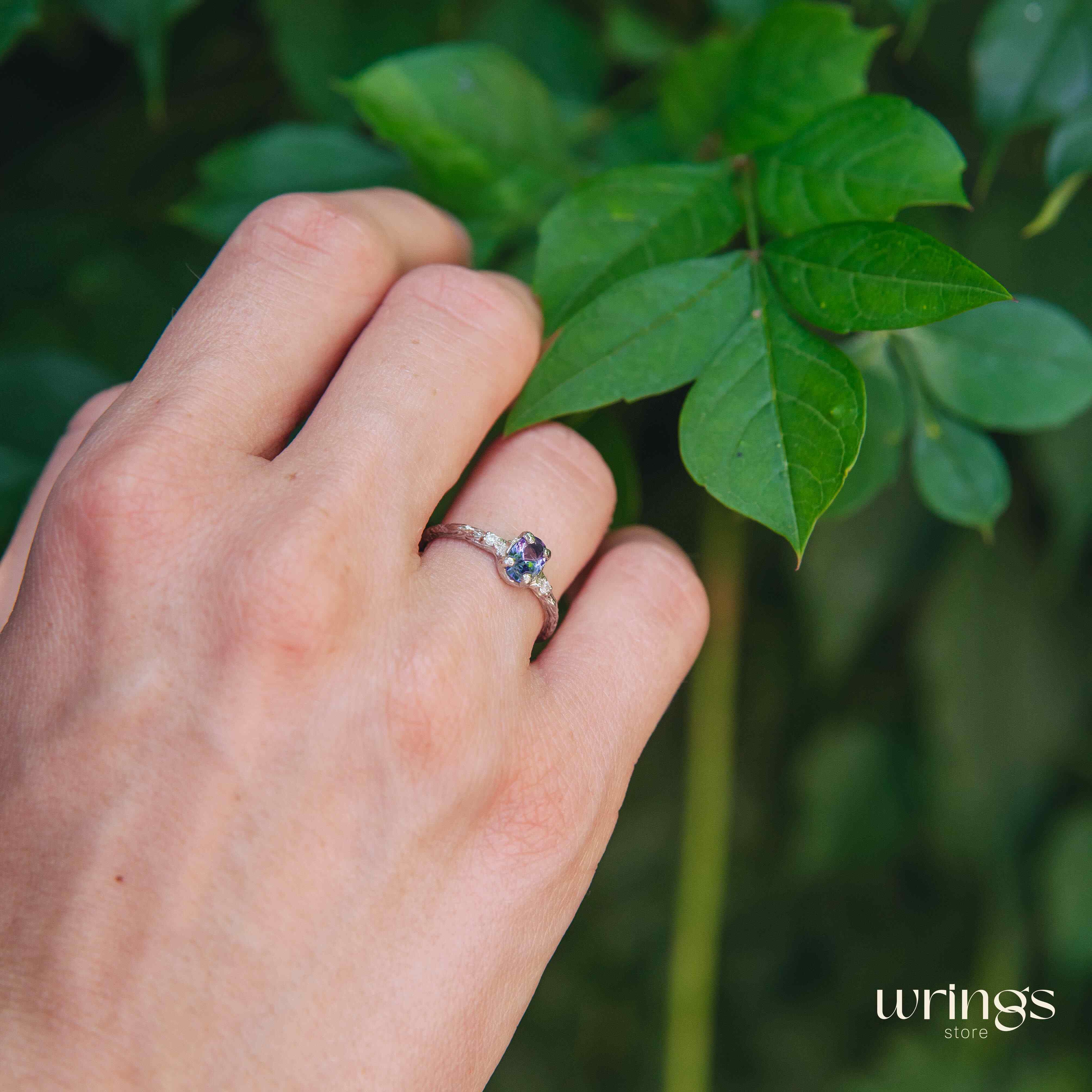Tanzanite in Small Silver Twig Ring & CZ Side Stones