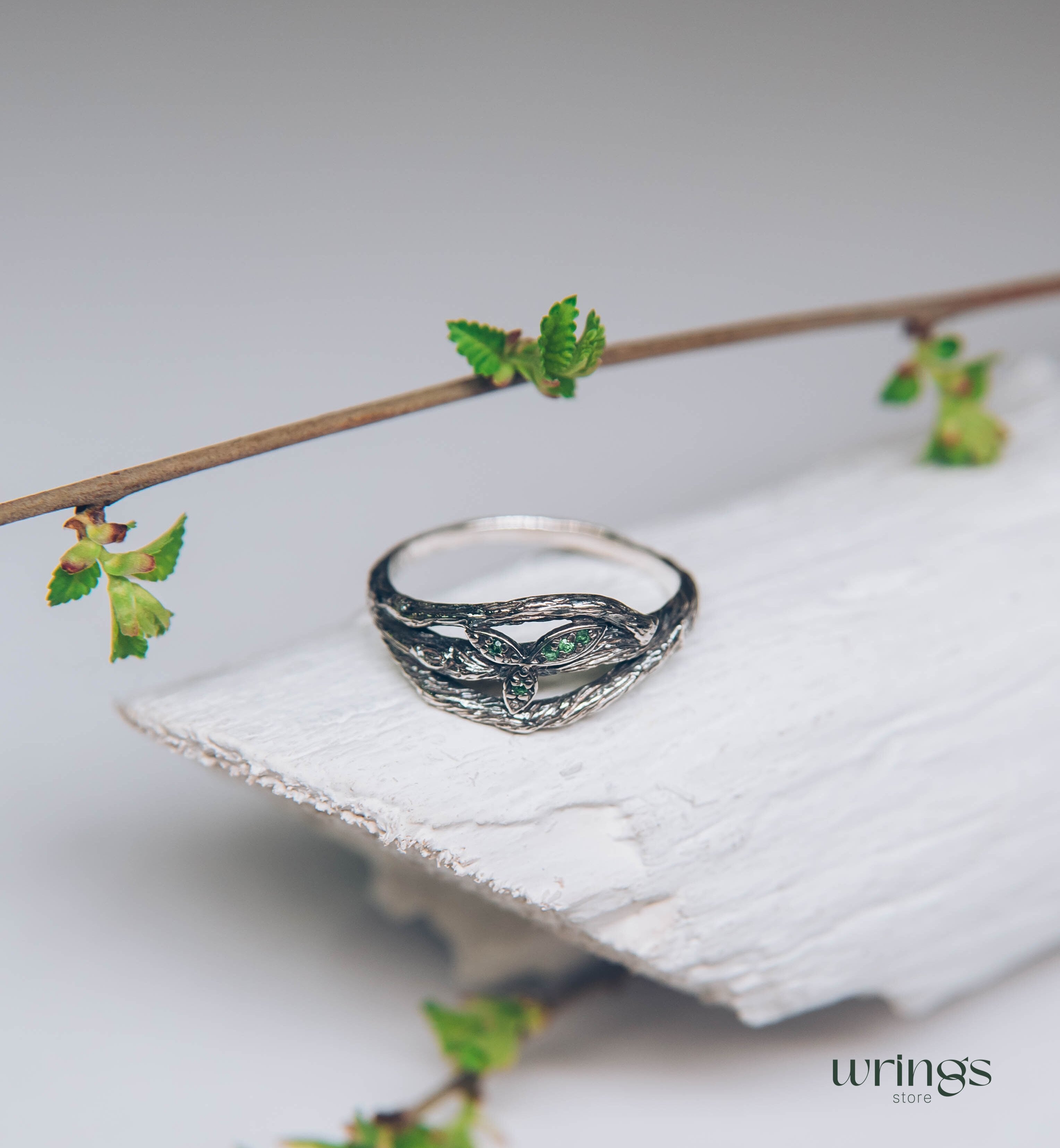 Subtle Silver Twisted Branch Unique Emerald Ring with Leaves