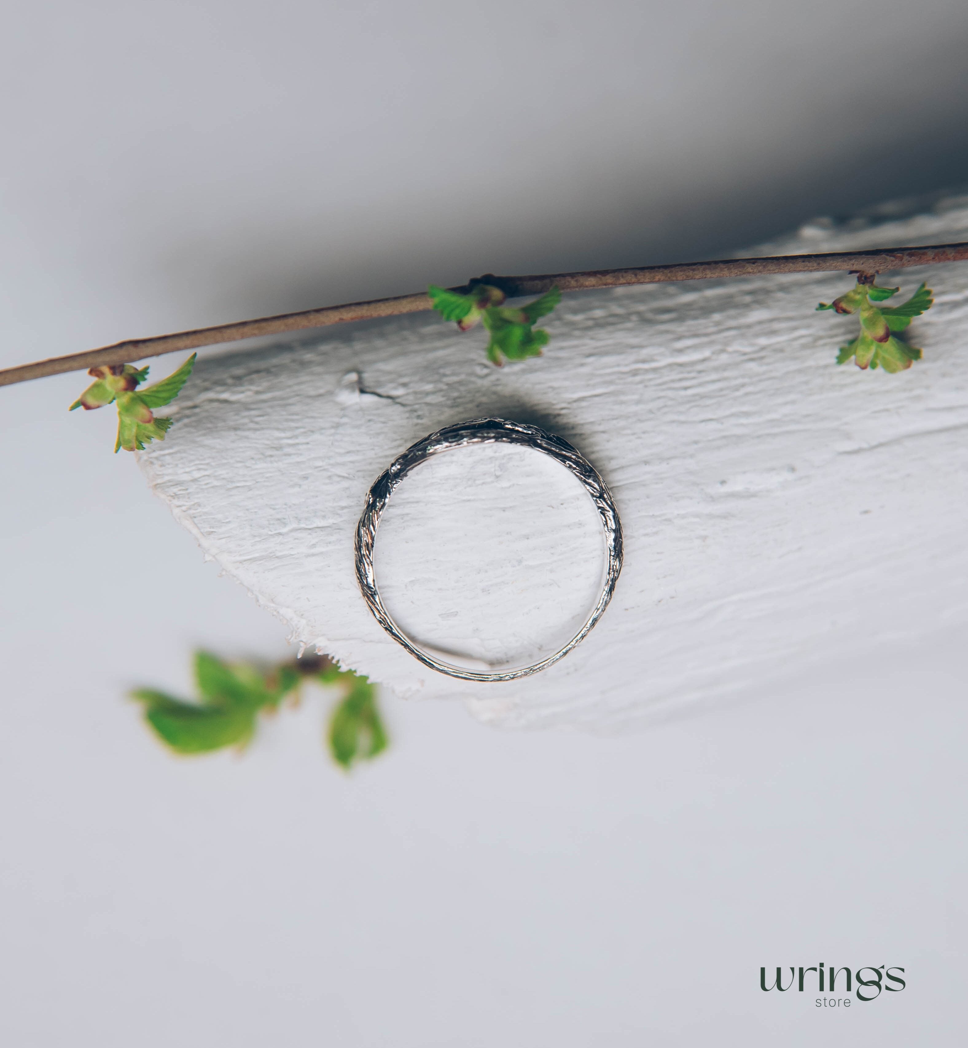 Subtle Silver Twisted Branch Unique Emerald Ring with Leaves