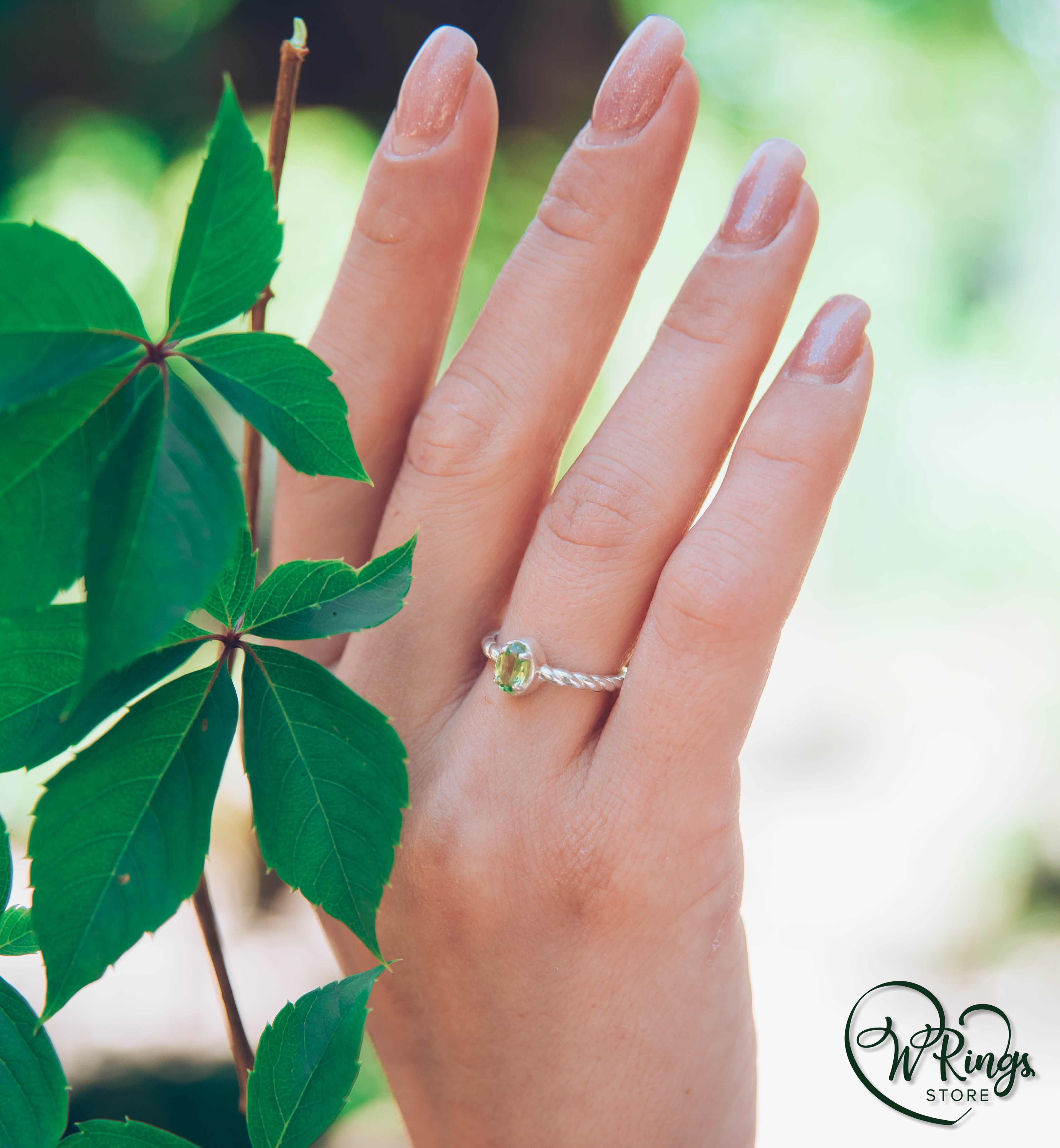 Oval shape Peridot Silver Solitaire Ring with rope style shank