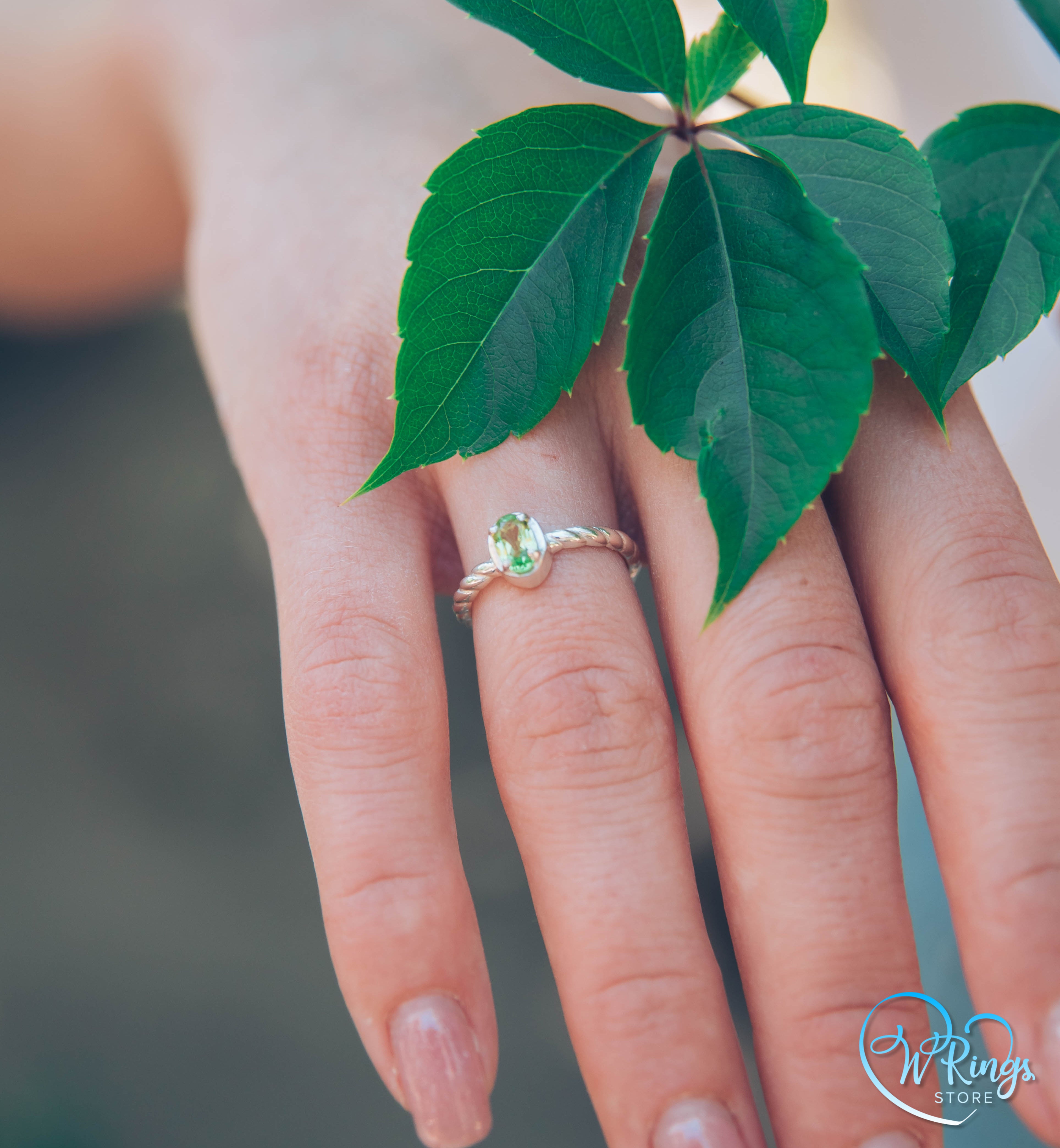 Oval shape Peridot Silver Solitaire Ring with rope style shank