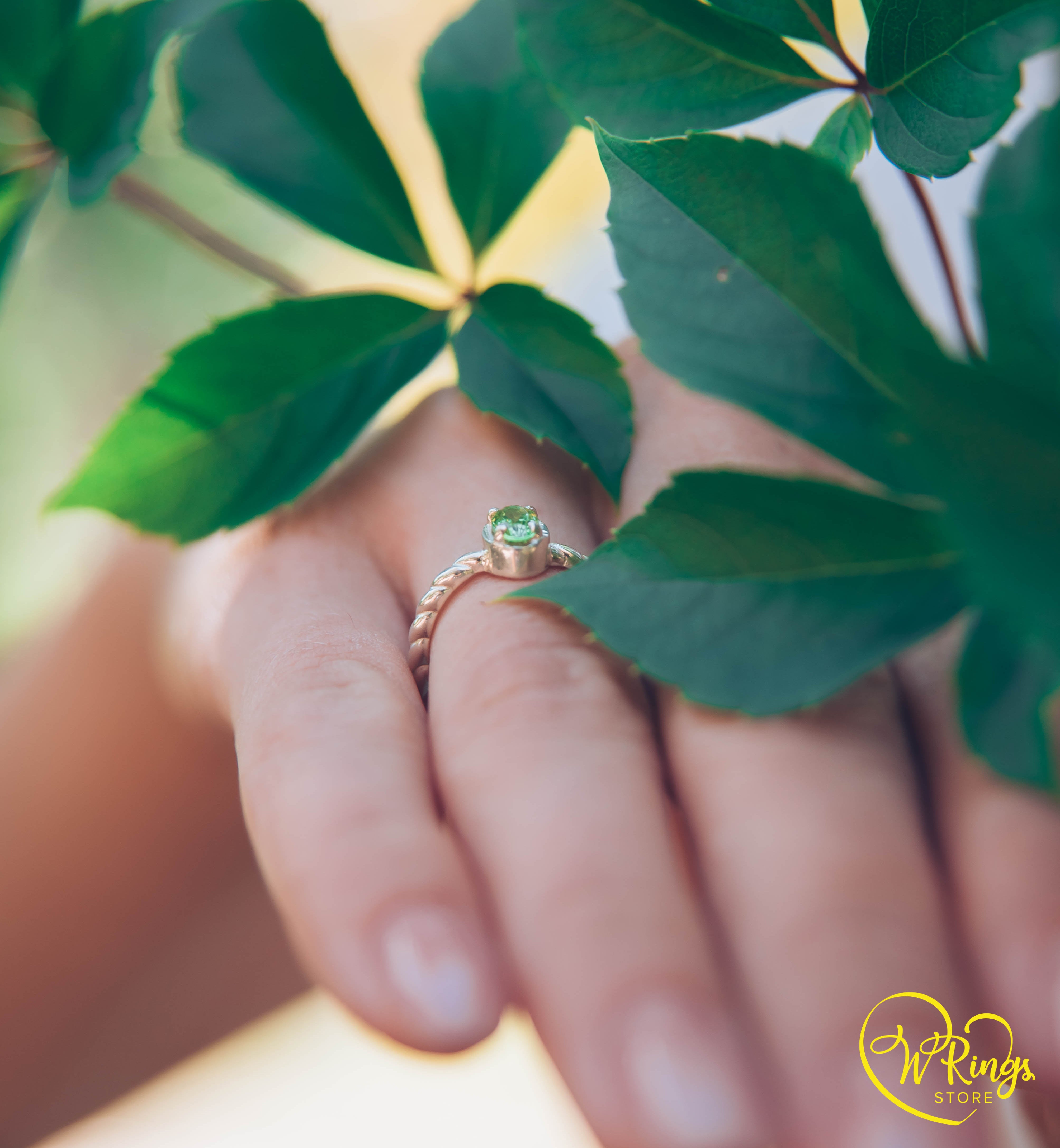 Oval shape Peridot Silver Solitaire Ring with rope style shank