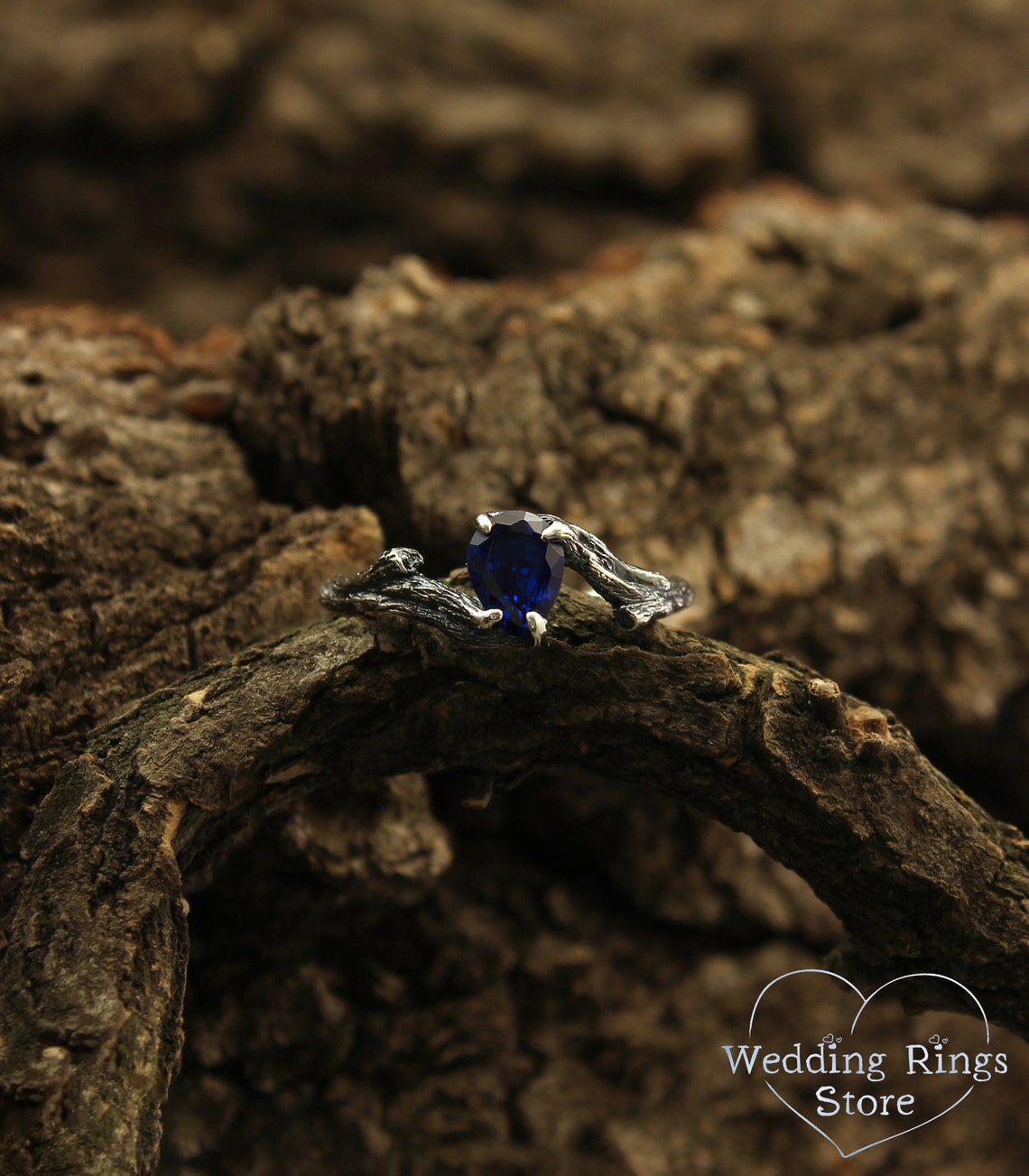 Pear cut Sapphire joins Silver Branches Engagement Ring