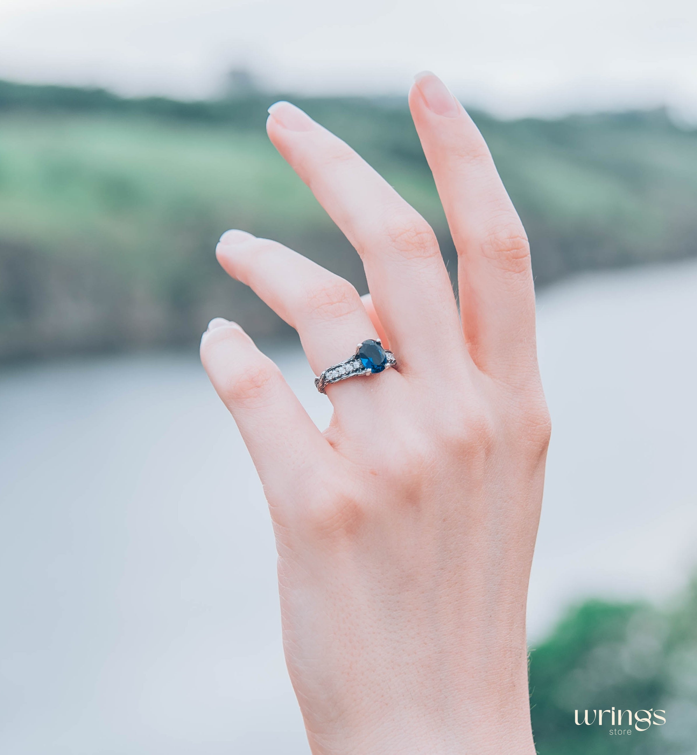 Dainty Oval Sapphire Ring – Side Stones on Silver Branch