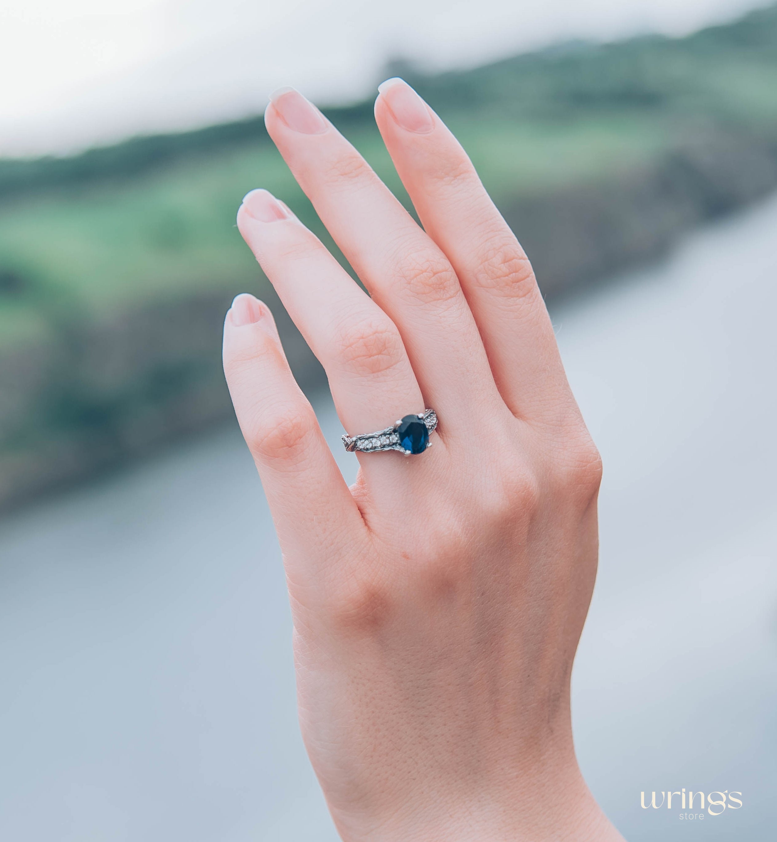 Dainty Oval Sapphire Ring – Side Stones on Silver Branch