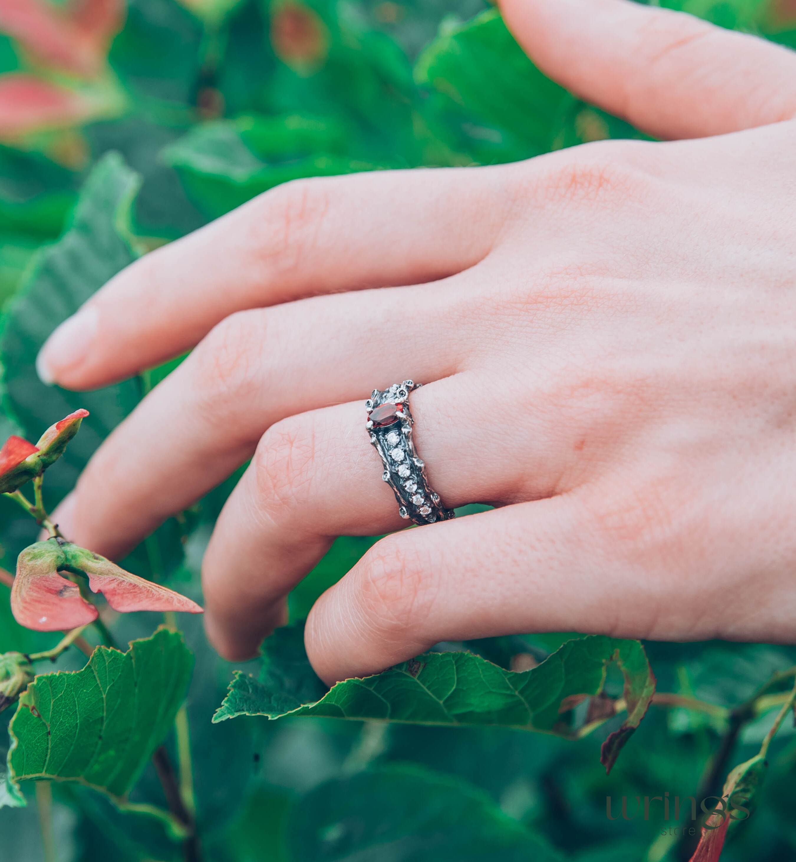 Knot and Branch Garnet Engagement Ring with Side Stones