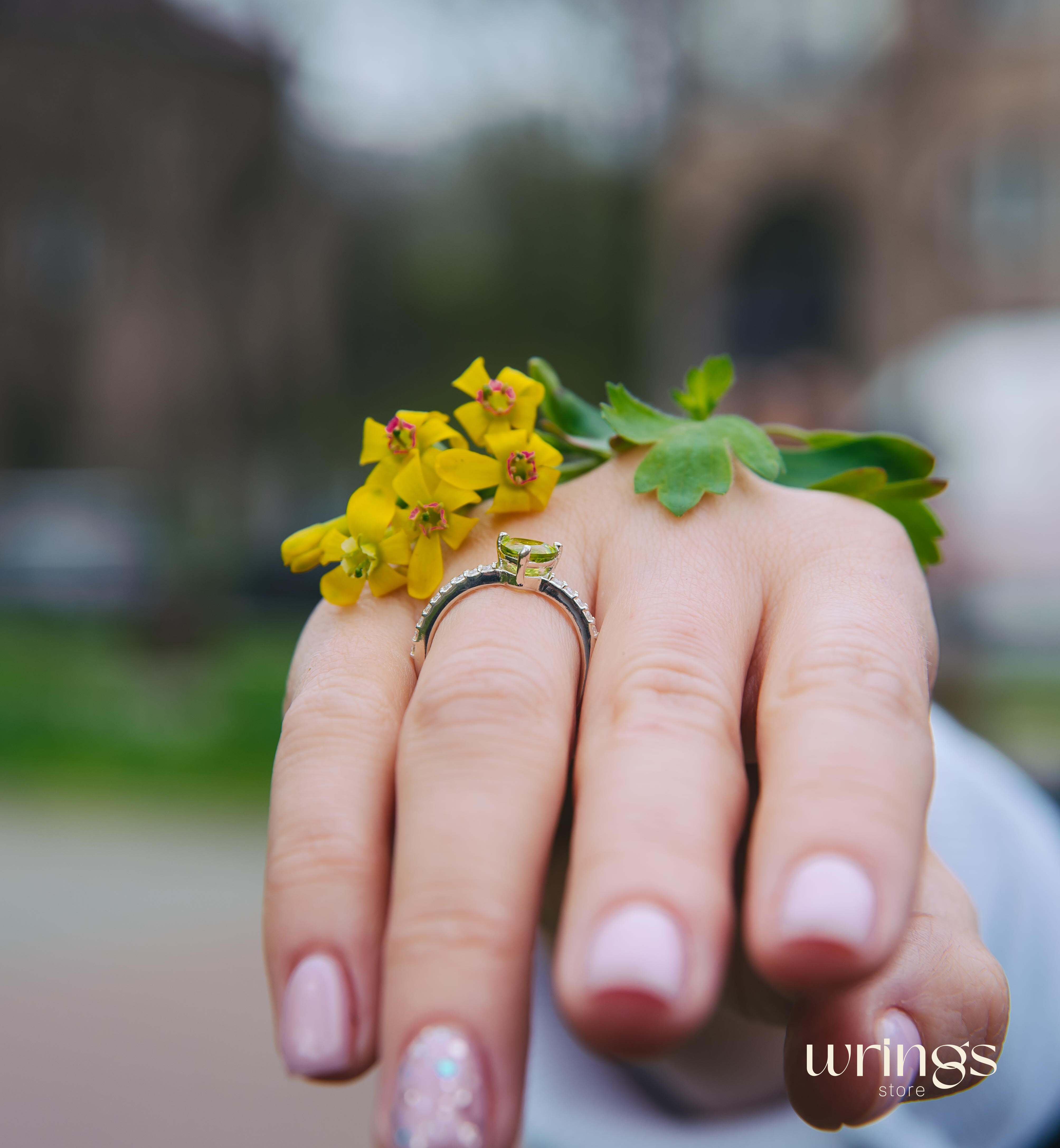 Trilliant Peridot Engagement Ring & CZ Side Stones